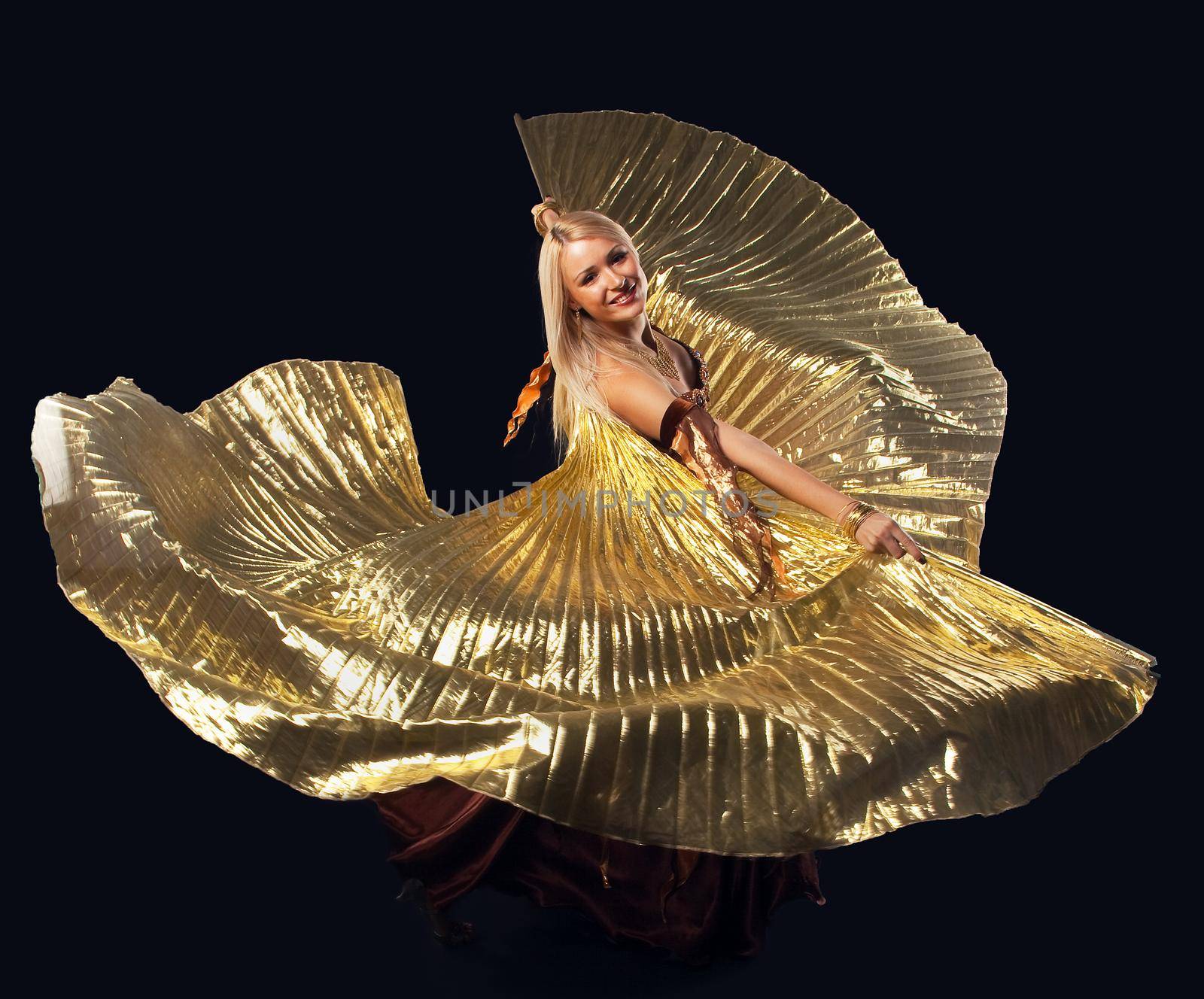 Beauty blond woman dance with flying gold wing by rivertime