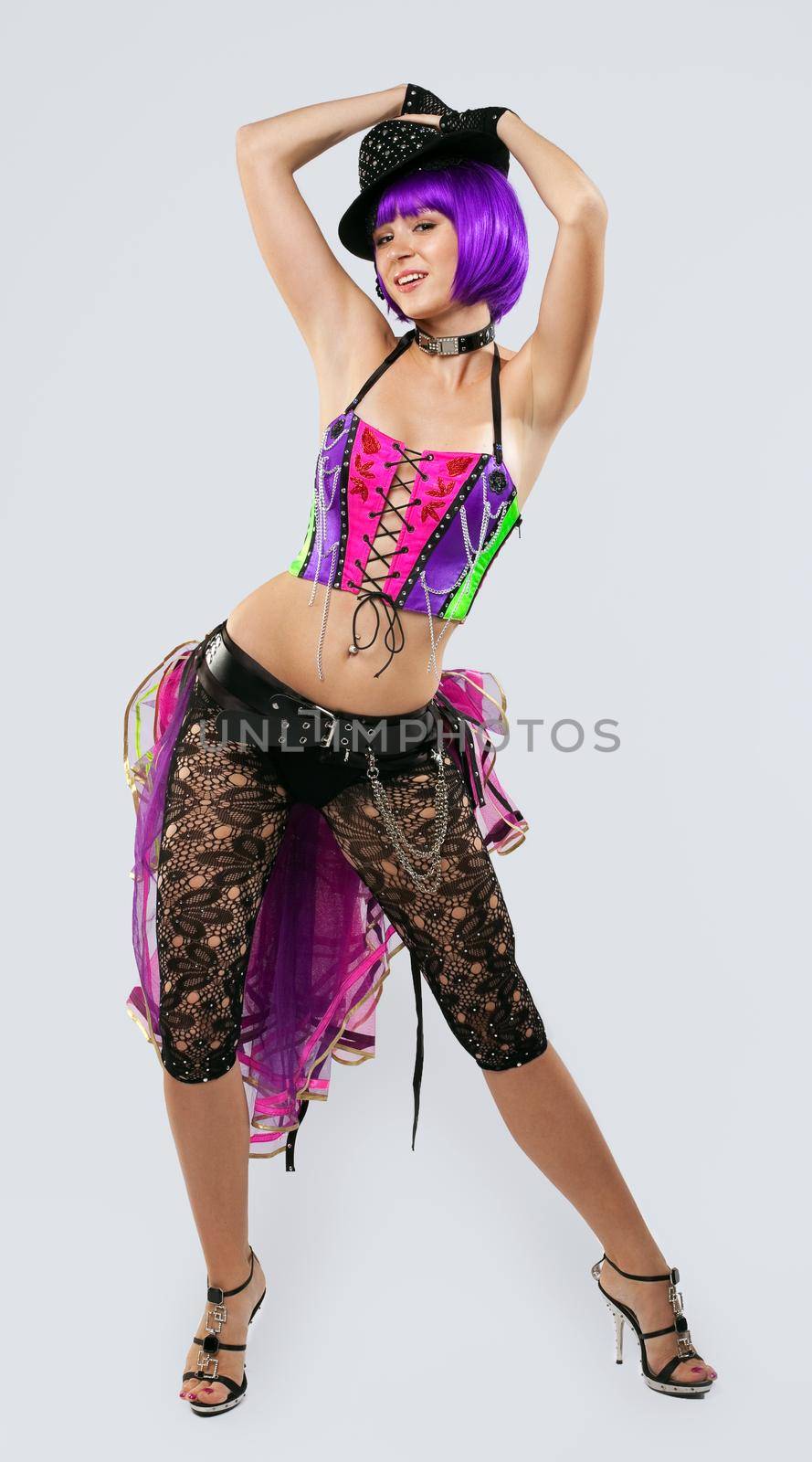 Blond disco girl dance in hat and color corset