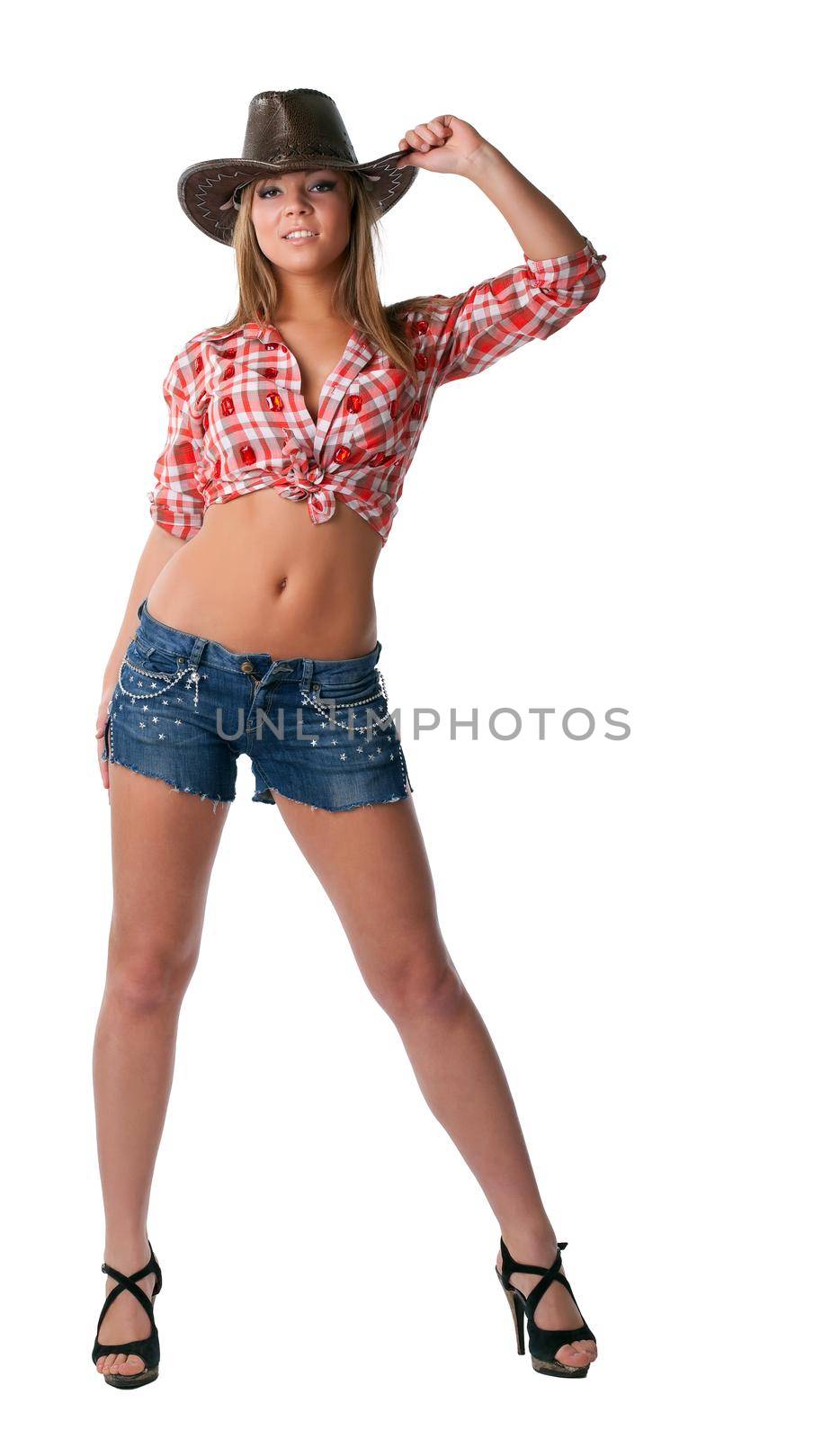 Beautiful sexy cowgirl stand in shorts isolated by rivertime