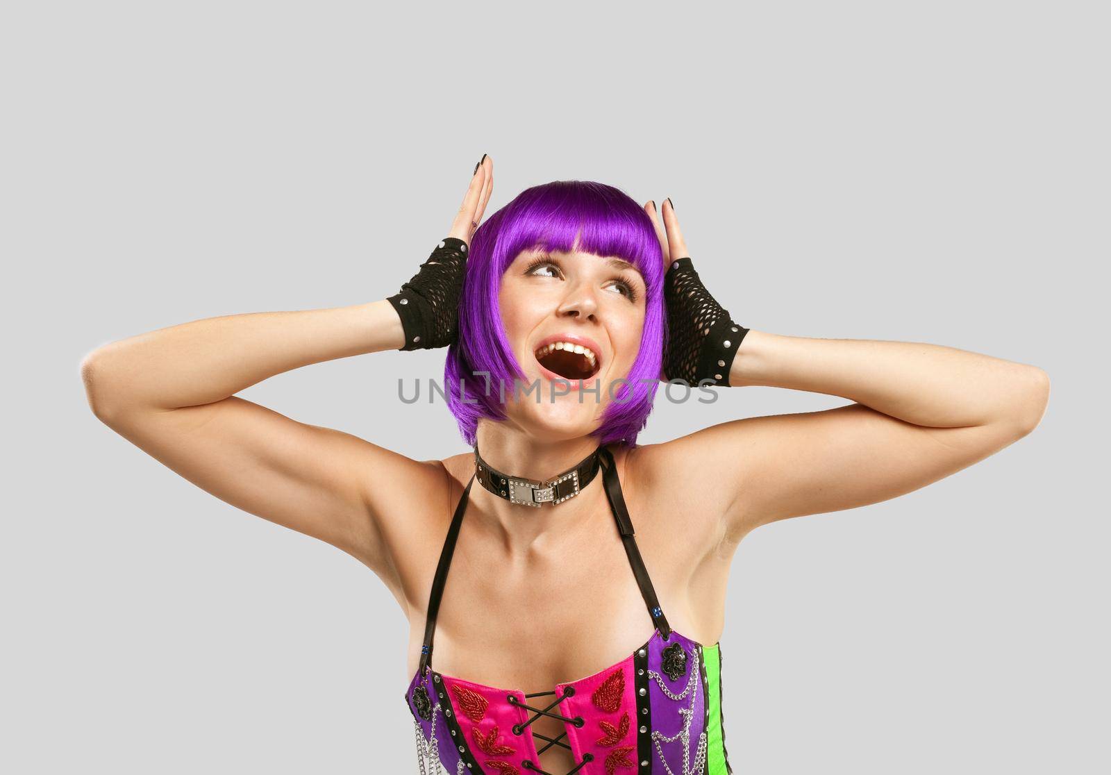 Young beauty Disco singer in purple hairs and corset