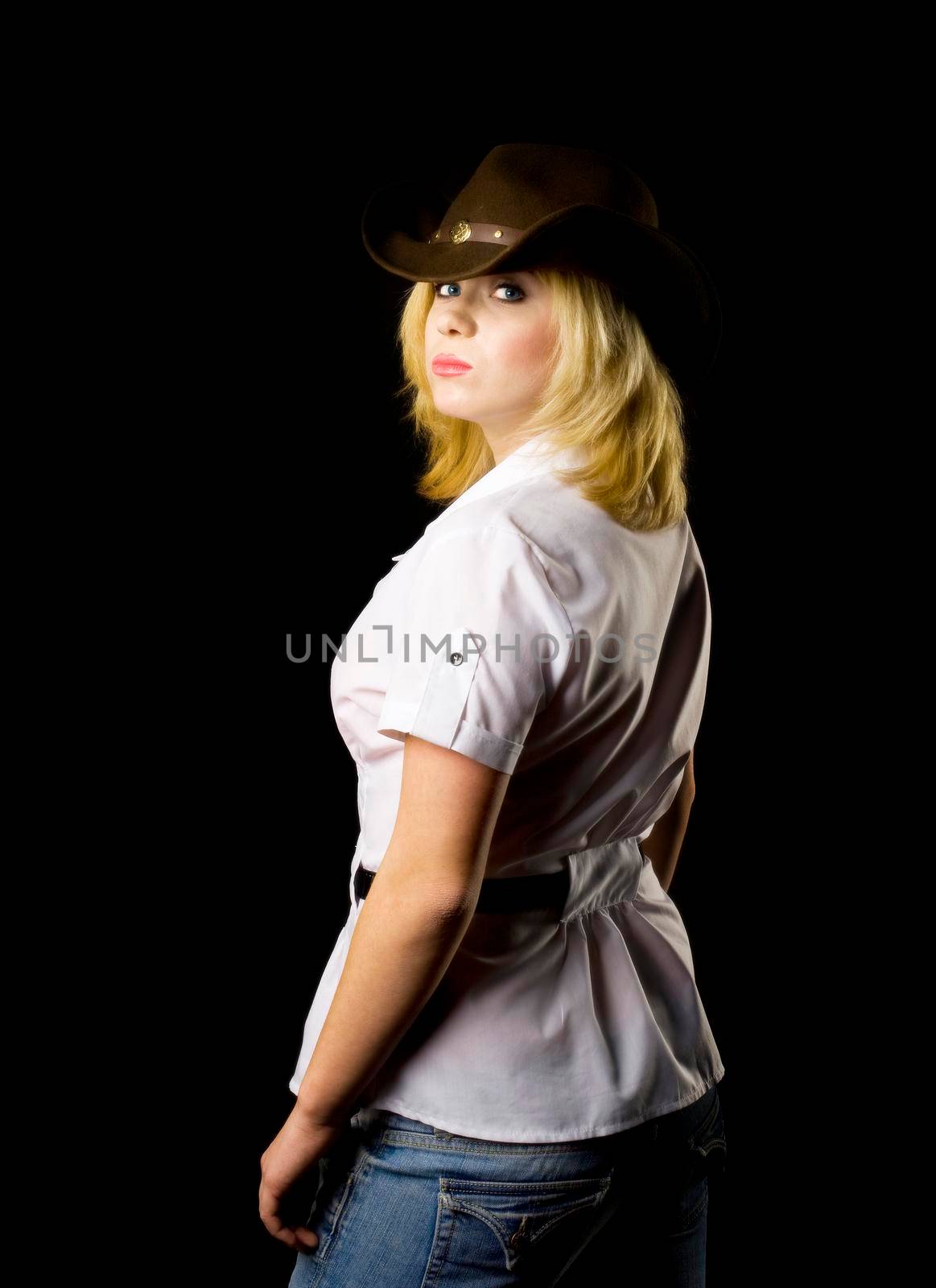 Blond CowGirl - studio shot back view
