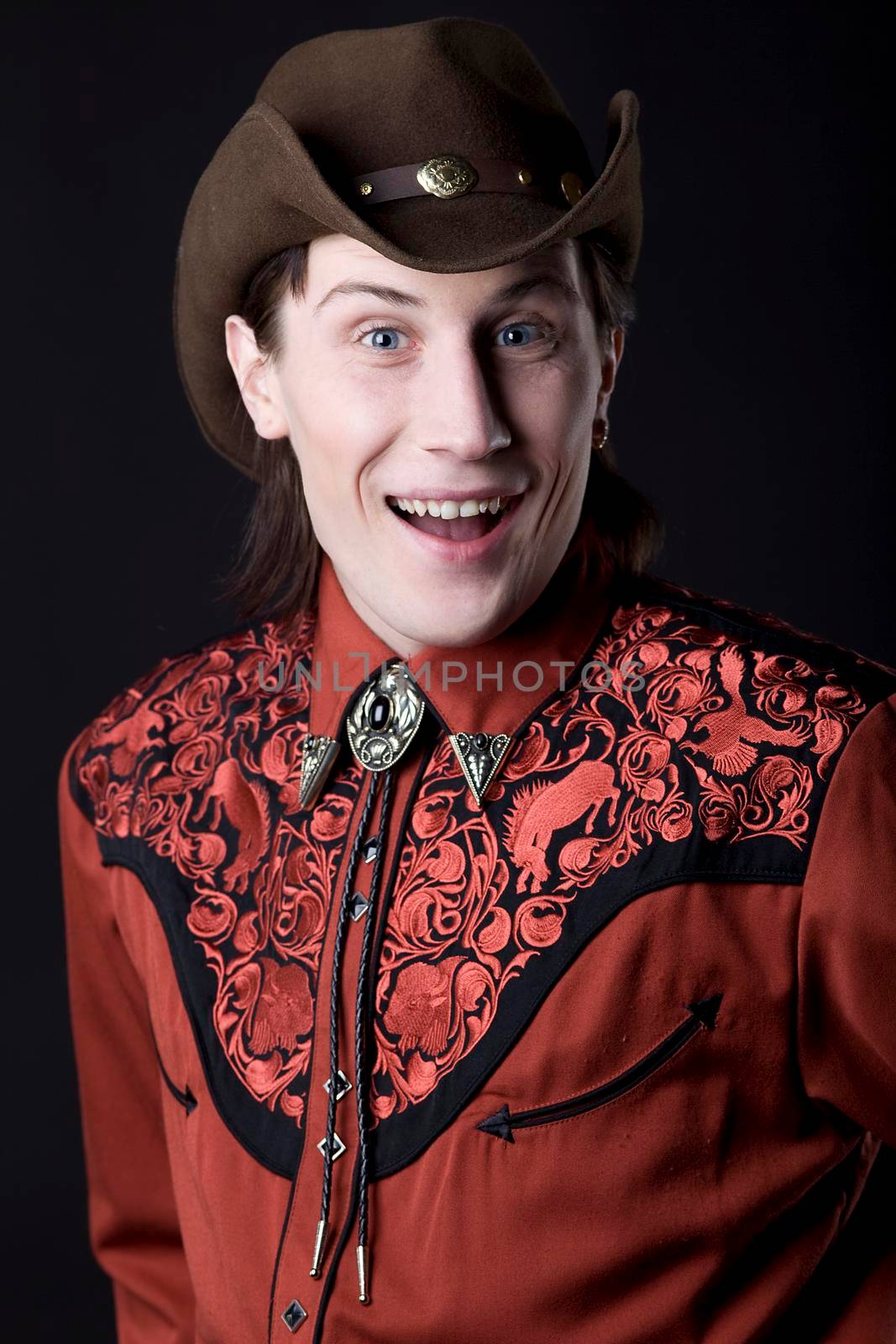 young fashion cowboy look at you smile