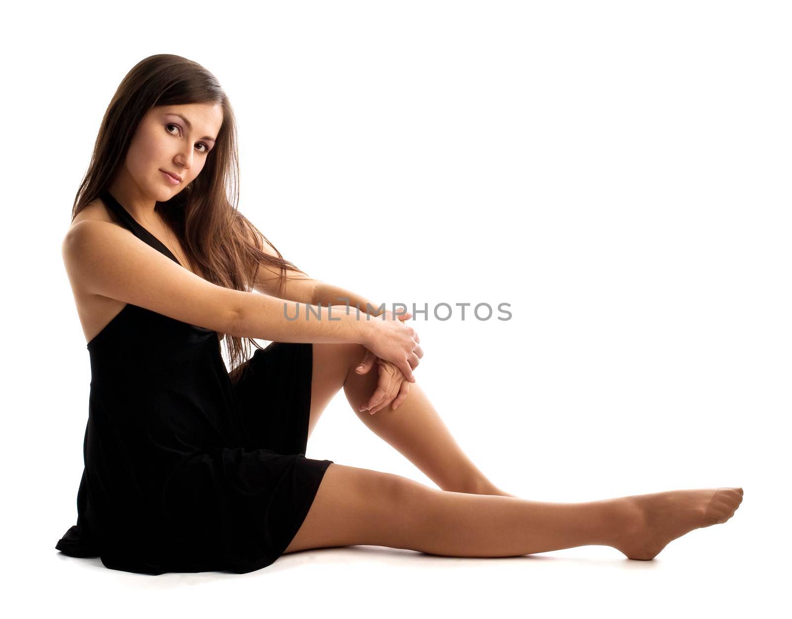 young dancer sit on white background isolated