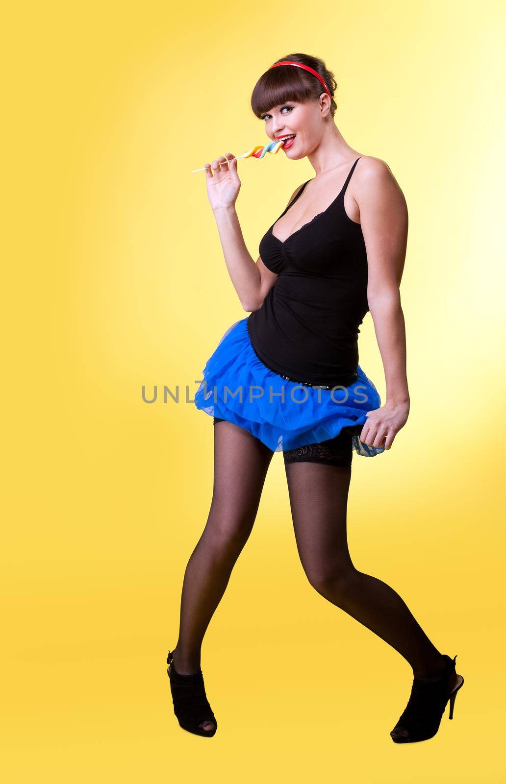 Beauty sexy woman with candy pinup style smile to you