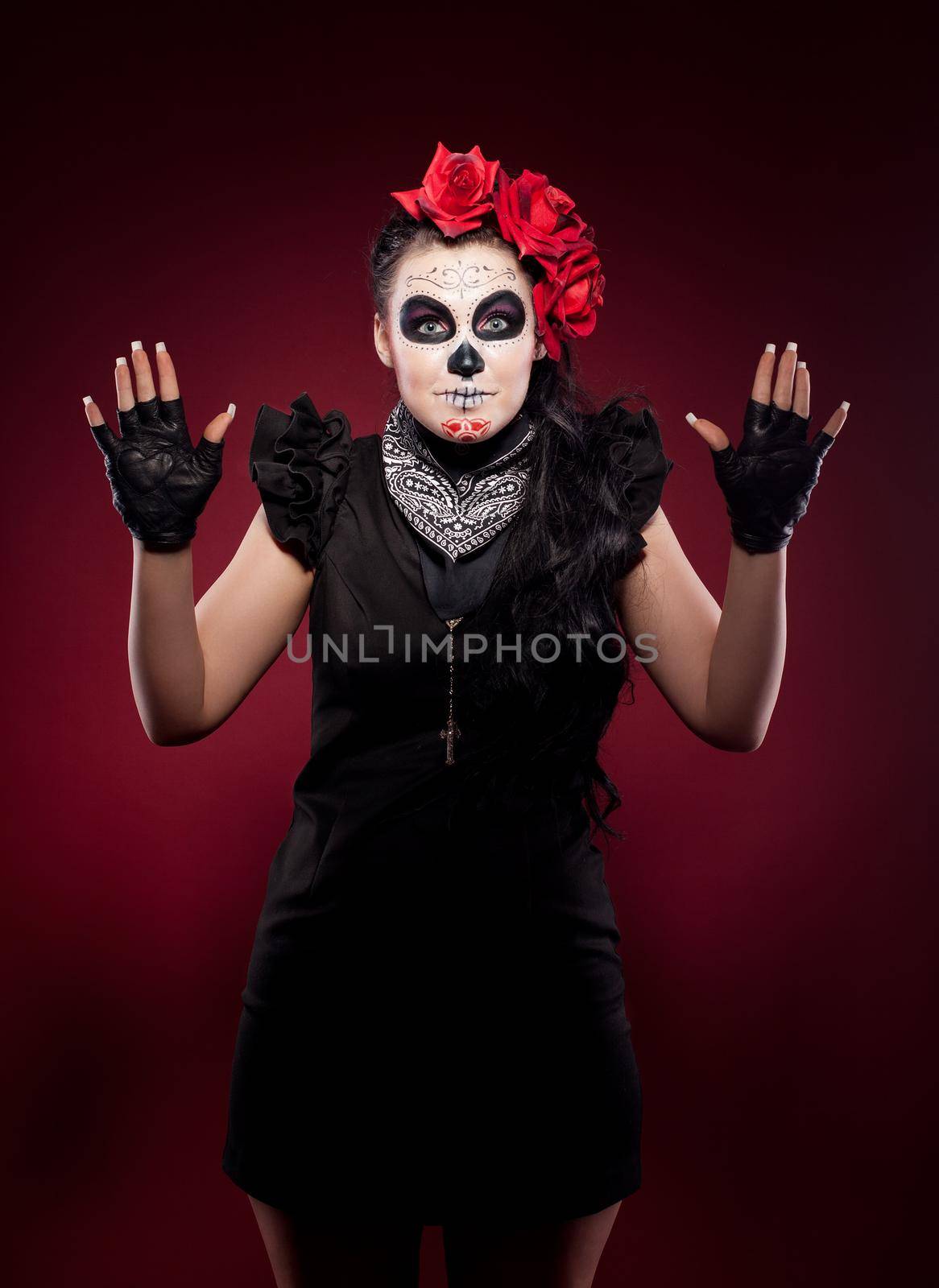 Young woman wearing with roses dressed up for All Souls Day smile snd show hands