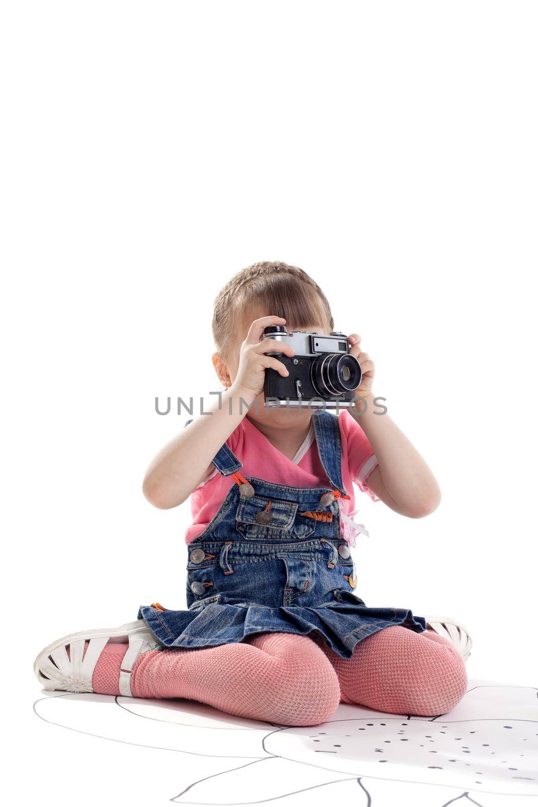 Girl sit with old-style film photo camera isolated