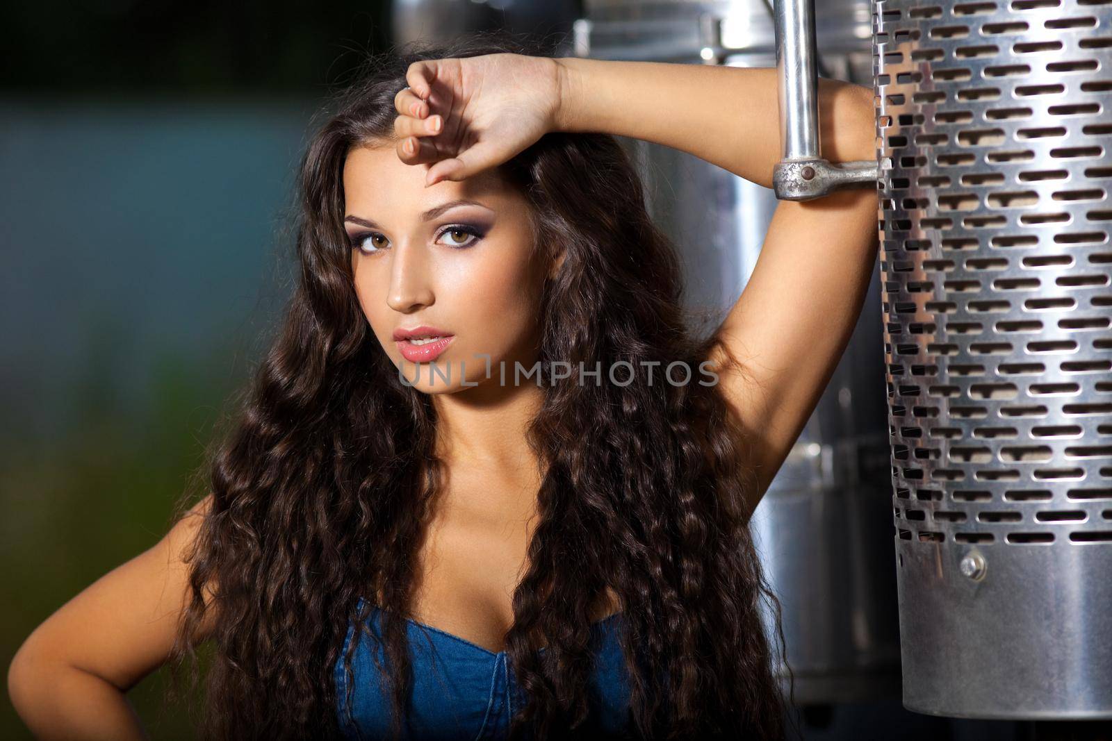 Young sexy girl portrait near steel truck at night