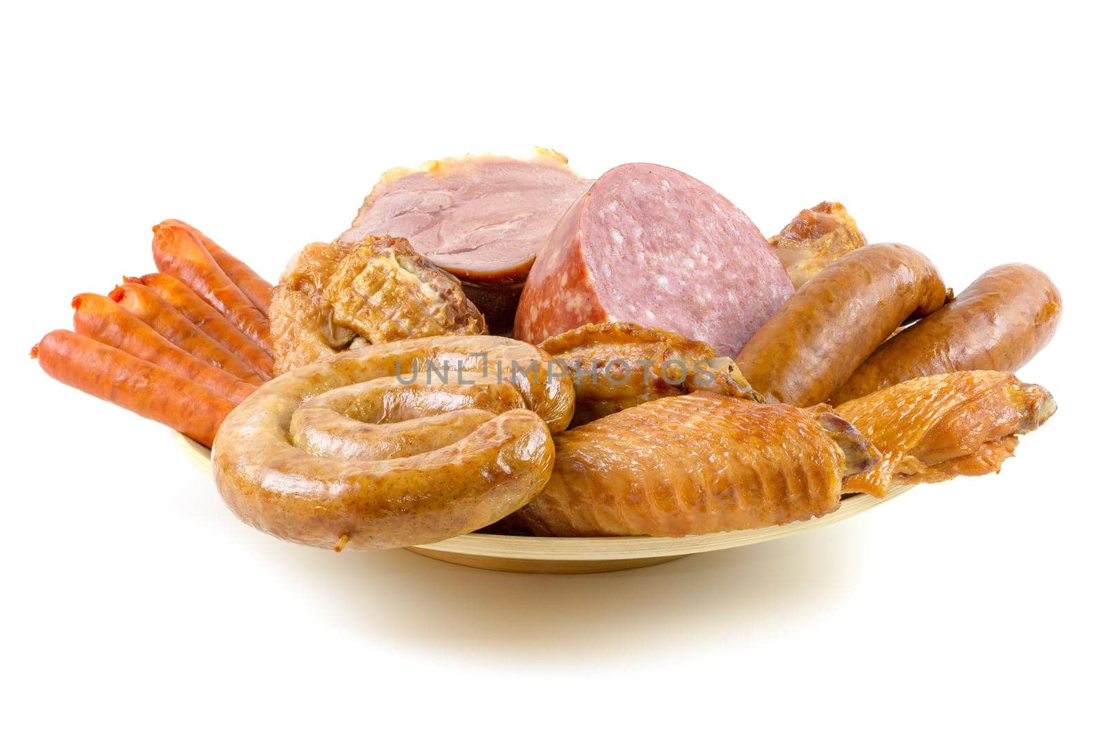Assortment of sausages on a wooden plate on a white background. Smoked meat products.