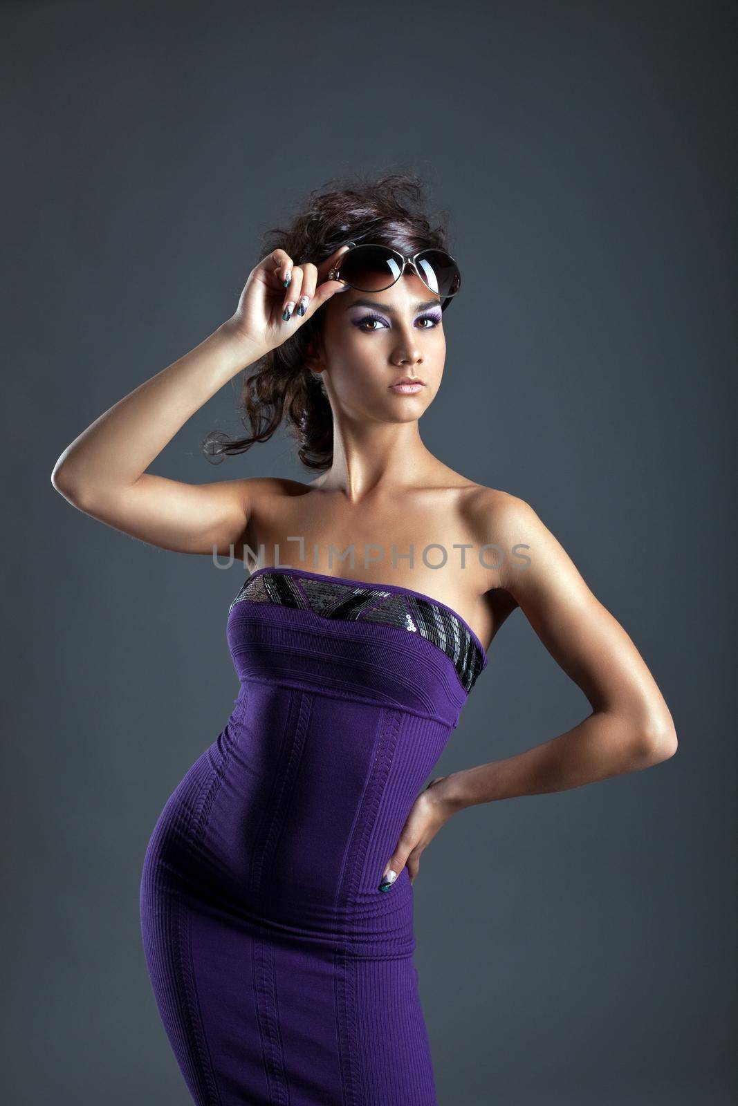 young woman with amazing figure take off glasses by rivertime