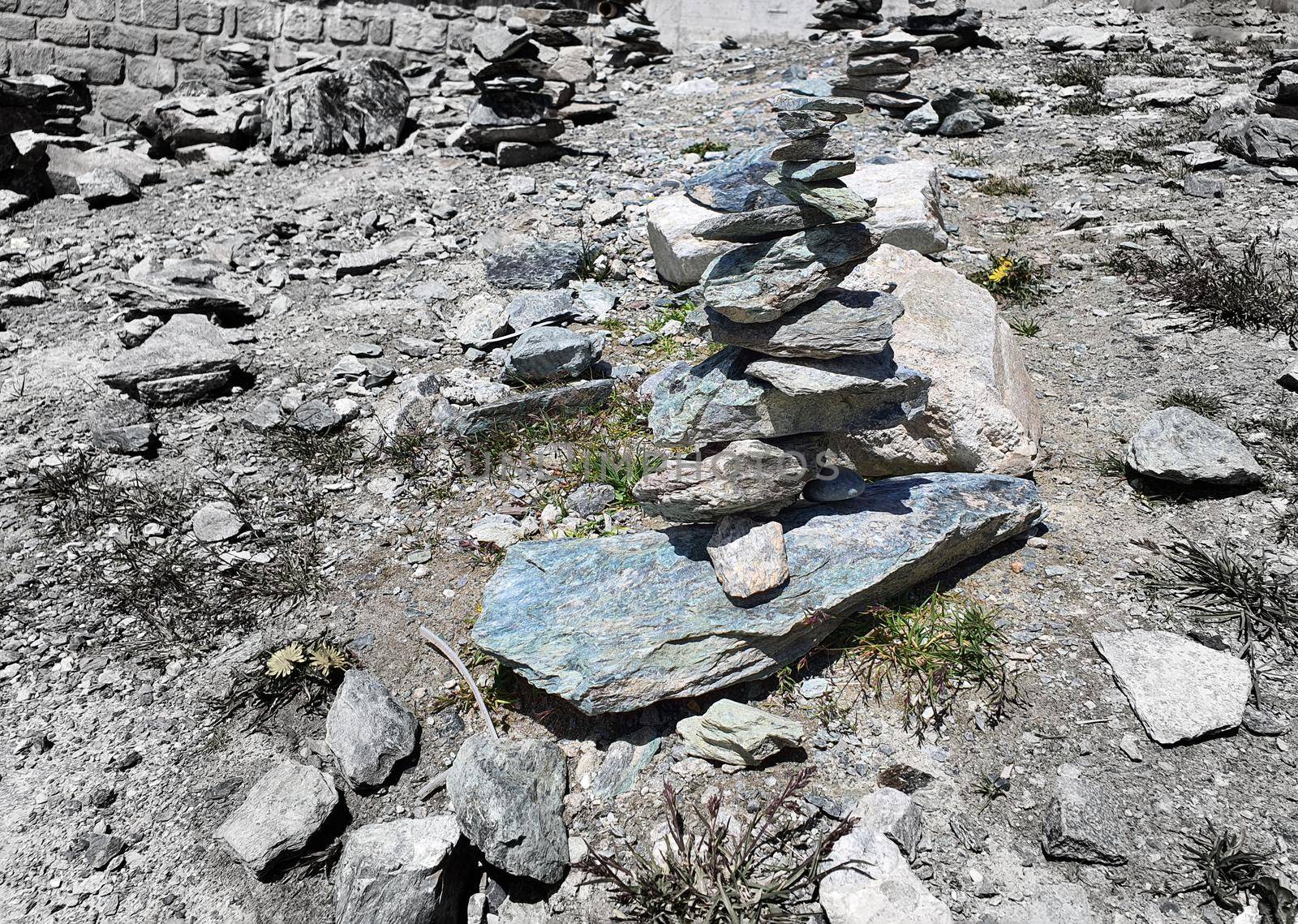 Stack of stones on top of the mountain. Pile of rocks stone and mountains. Balanced stone pyramid or Stacked stone or mountain stones tower. Stones arranged for meditation. Represent spirit of Zen.