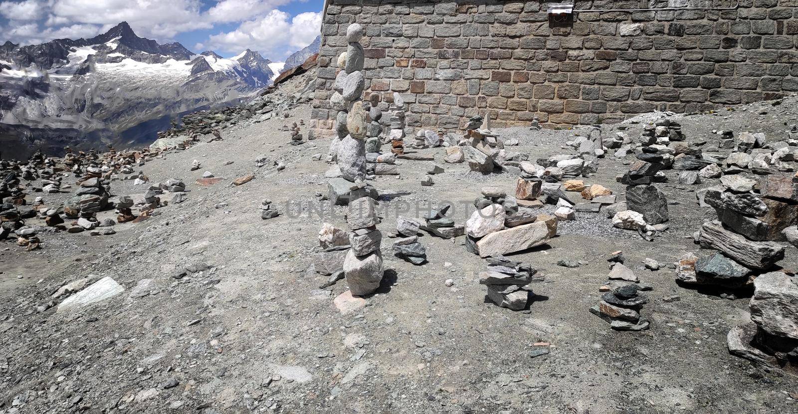 Stack of stones on top of the mountain. Pile of rocks stone and mountains. Balanced stone pyramid or Stacked stone or mountain stones tower. Stones arranged for meditation. Represent spirit of Zen.