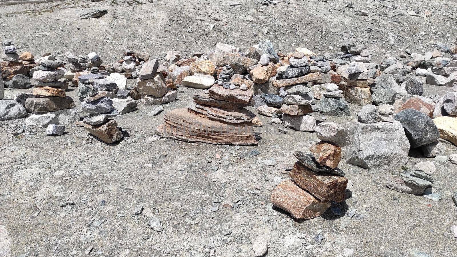 Stack of stones on top of the mountain. Pile of rocks stone and mountains. Balanced stone pyramid or Stacked stone or mountain stones tower. Stones arranged for meditation. Represent spirit of Zen.