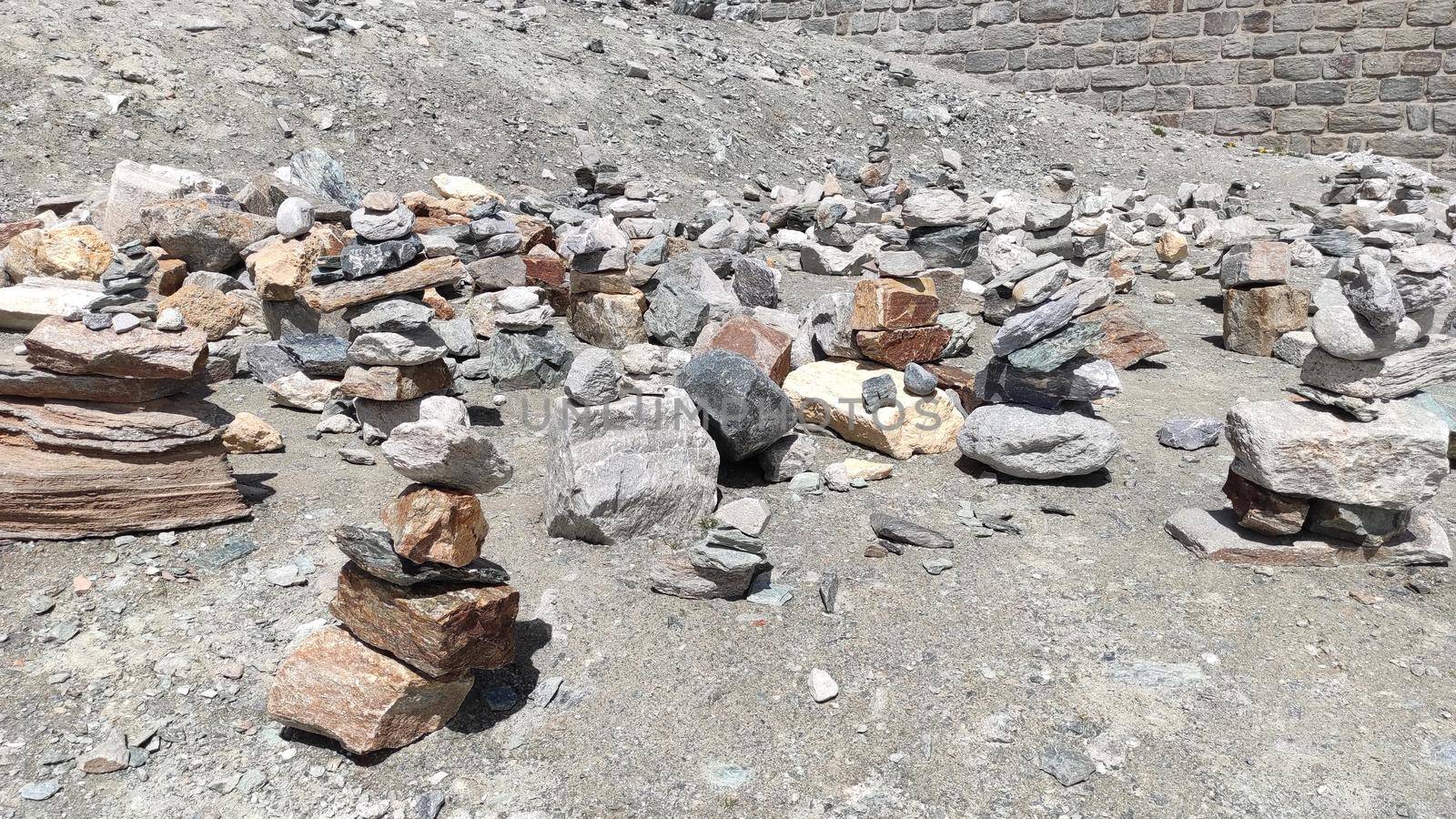 Stack of stones on top of the mountain. Pile of rocks stone and mountains. Balanced stone pyramid or Stacked stone or mountain stones tower. Stones arranged for meditation. Represent spirit of Zen.