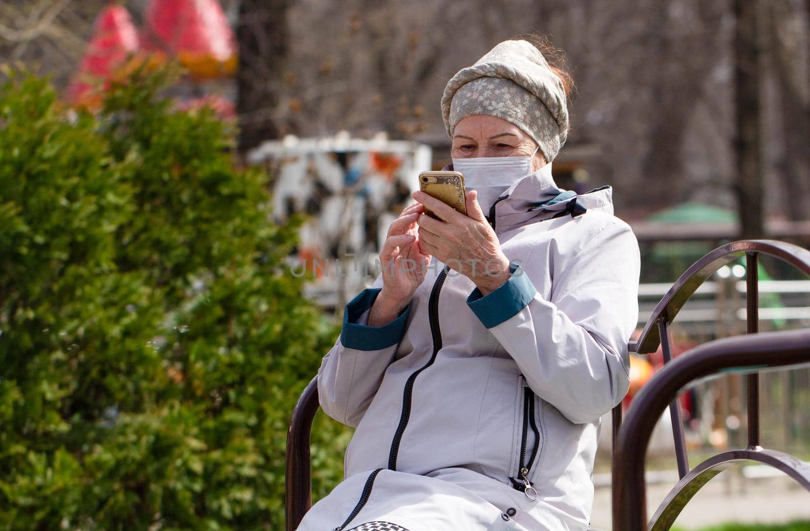 Coronavirus. Portrait of an elderly woman in a surgical mask. Protocols for the protection and prevention of coronaviruses. Stay at home.