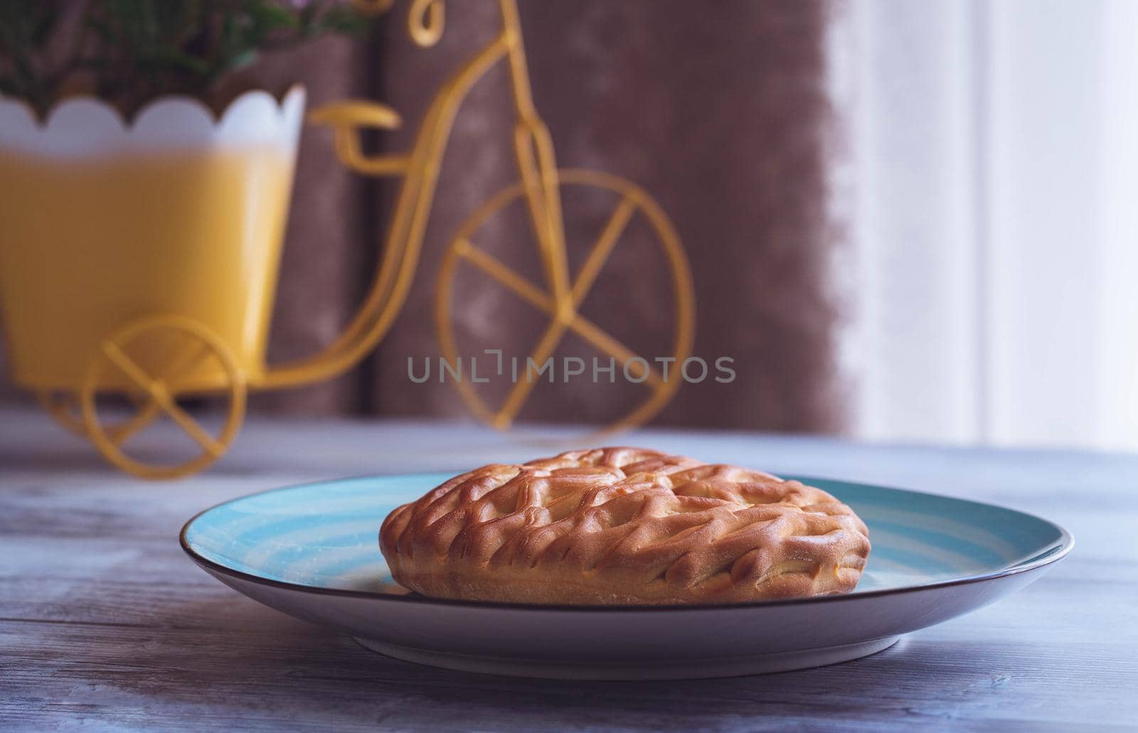 Fresh homemade open pie with cottage cheese and raisins. Traditional Russian yeast pastries, cheesecake, round buns, cottage cheese pie. Buns with cottage cheese and raisins.