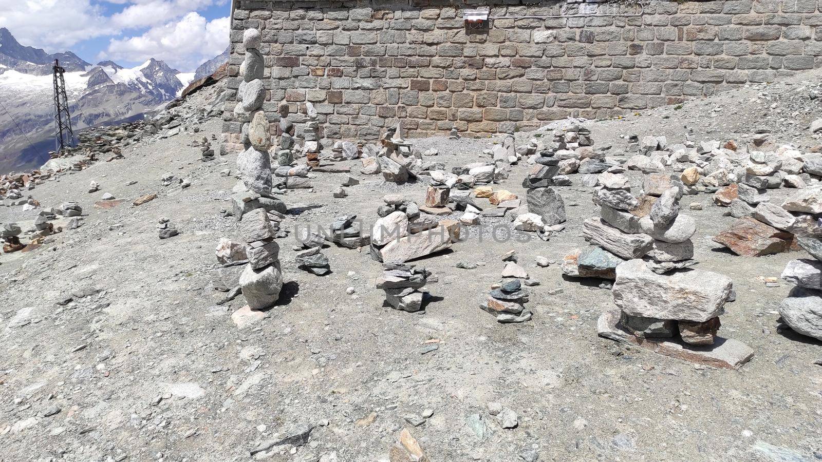 Stack of stones on top of the mountain. Pile of rocks stone and mountains. Balanced stone pyramid or Stacked stone or mountain stones tower. Stones arranged for meditation. Represent spirit of Zen.