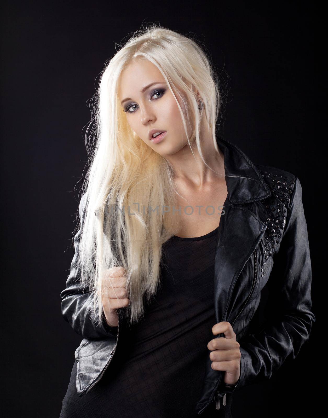 Beauty young blond girl in leather jacket