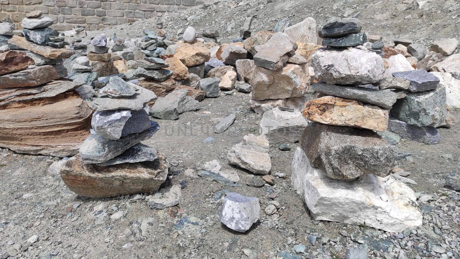 Stack of stones on top of the mountain. Pile of rocks stone and mountains. Balanced stone pyramid or Stacked stone or mountain stones tower. Stones arranged for meditation. Represent spirit of Zen.