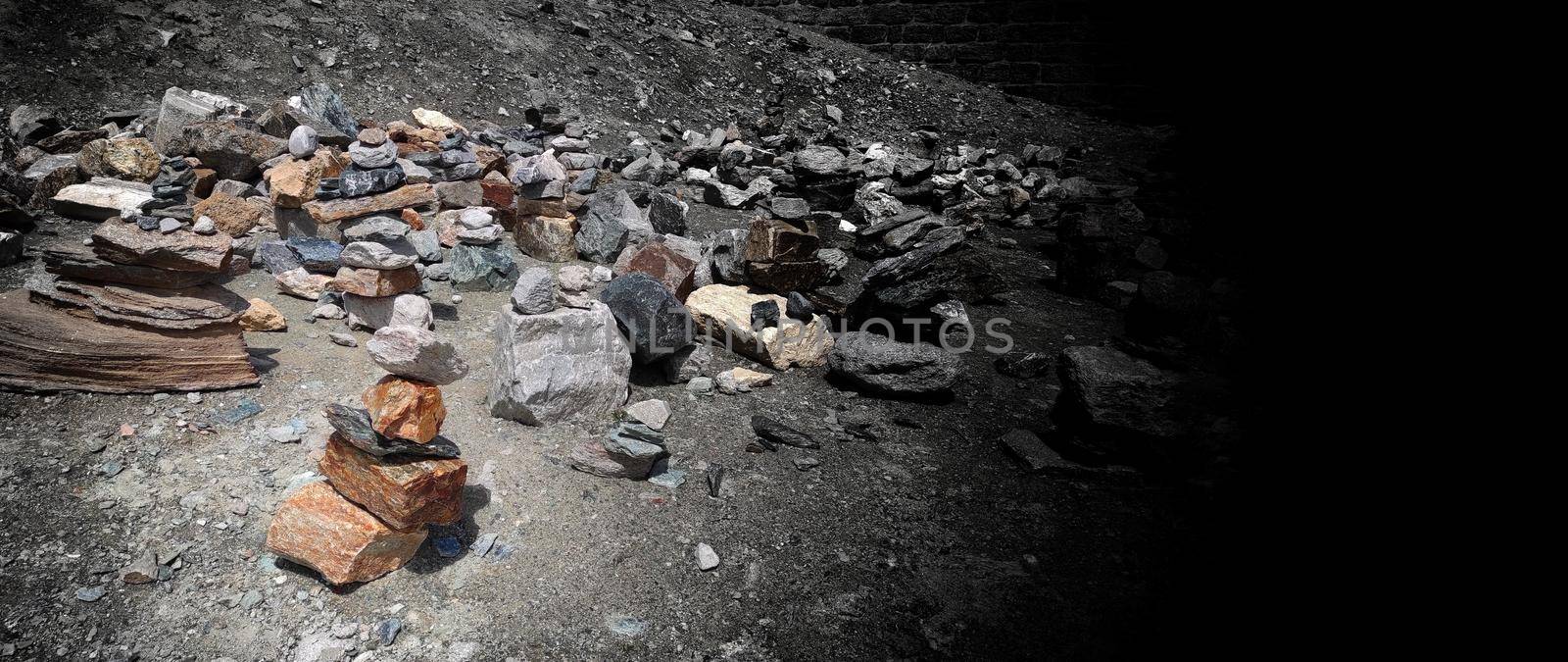 Stack of stones on top of the mountain. Pile of rocks stone and mountains. Balanced stone pyramid or Stacked stone or mountain stones tower. Stones arranged for meditation. Represent spirit of Zen.