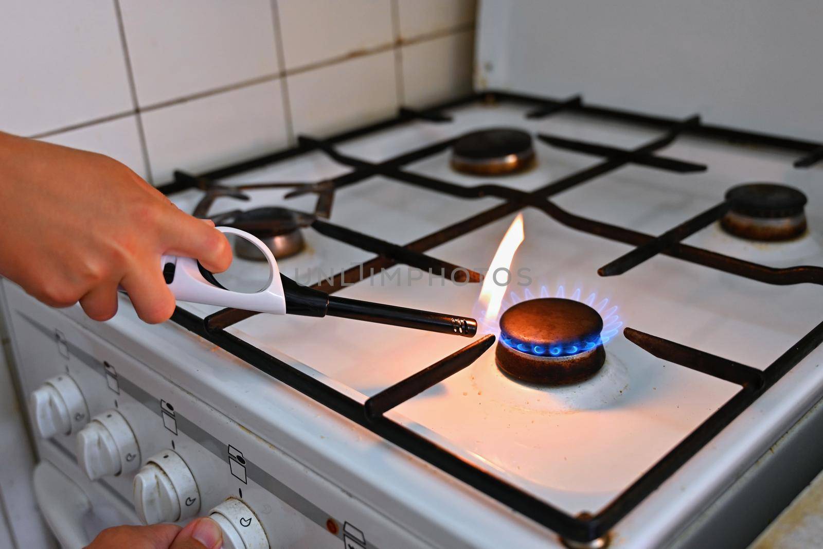 Gas stove for cooking in the kitchen. Gas crisis in Europe - high energy prices and stoppage of gas supplies. Russian war in Ukraine.