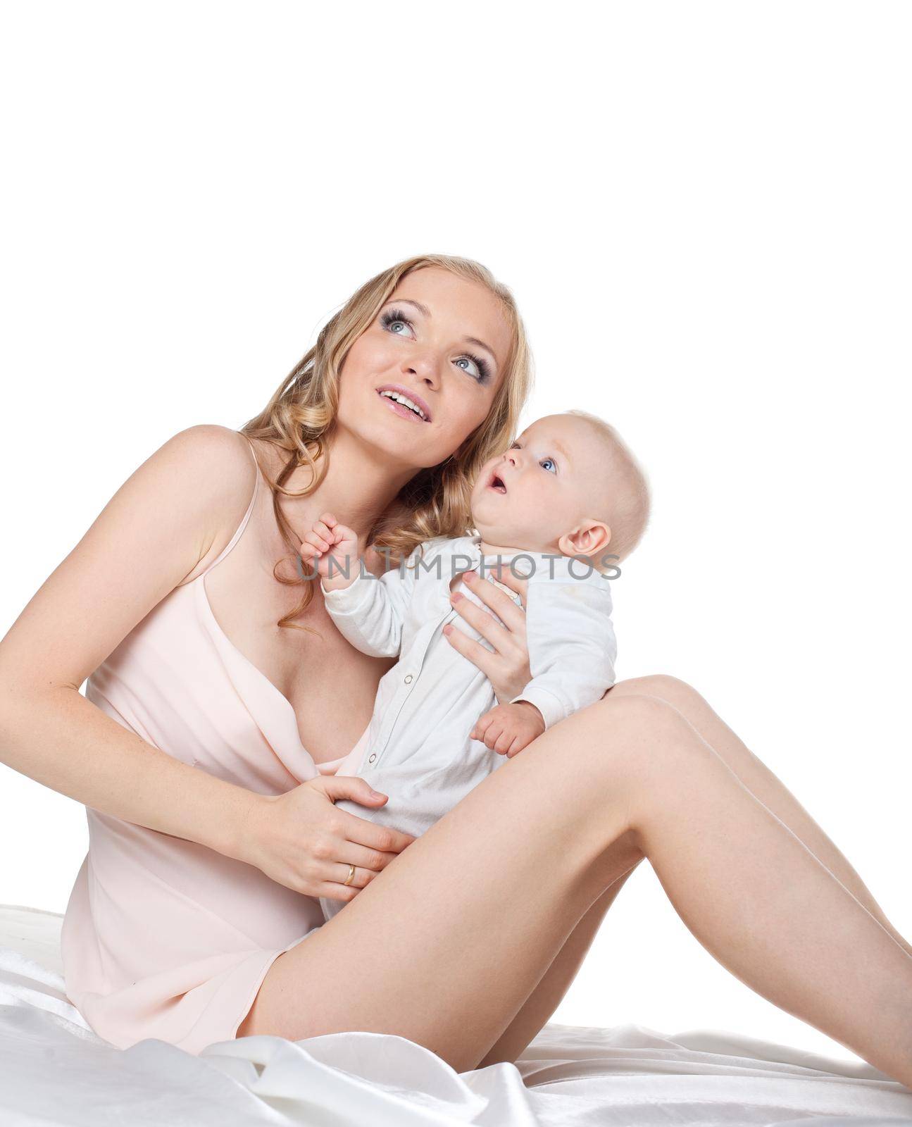 Beauty young mother with small baby look at light