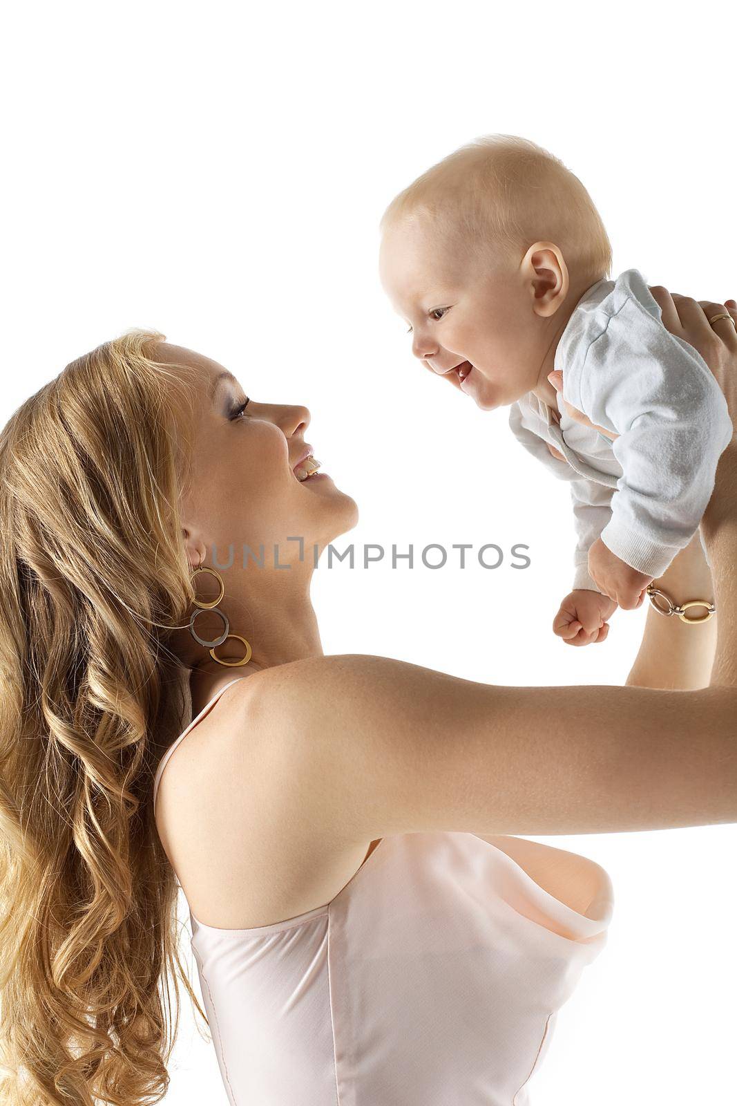 Beauty young mother with baby in hands at top isolated