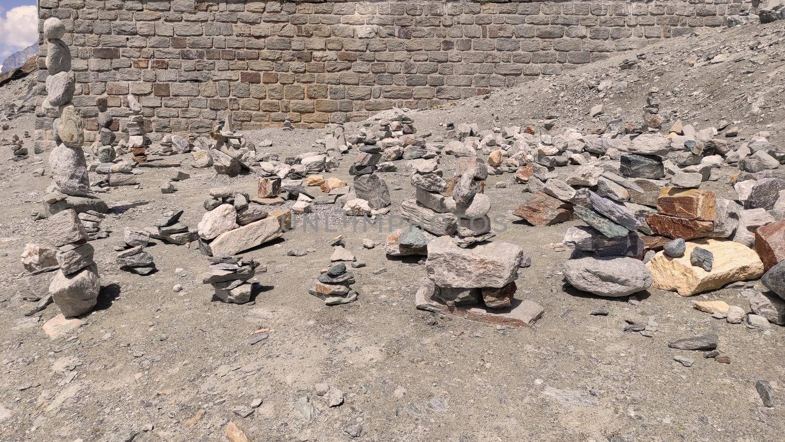 Stack of stones on top of the mountain. Pile of rocks stone and mountains. Balanced stone pyramid or Stacked stone or mountain stones tower. Stones arranged for meditation. Represent spirit of Zen.