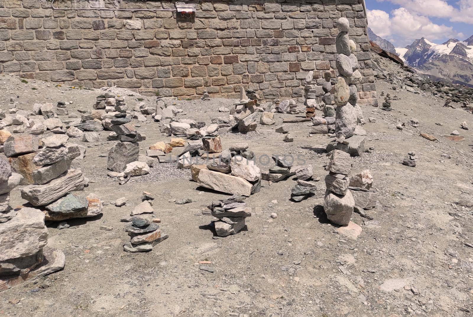 Stack of stones on top of the mountain. Pile of rocks stone and mountains. Balanced stone pyramid or Stacked stone or mountain stones tower. Stones arranged for meditation. Represent spirit of Zen.