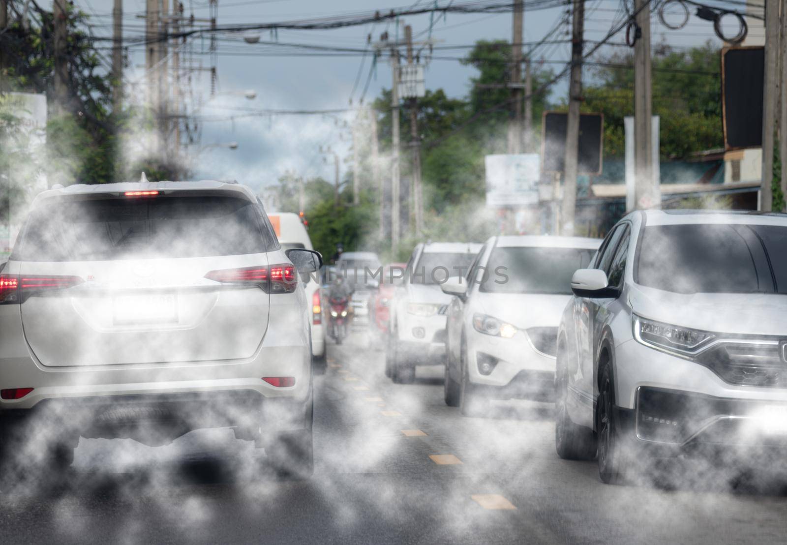 Car exhaust fumes during traffic jams on the road cause environmental emissions.