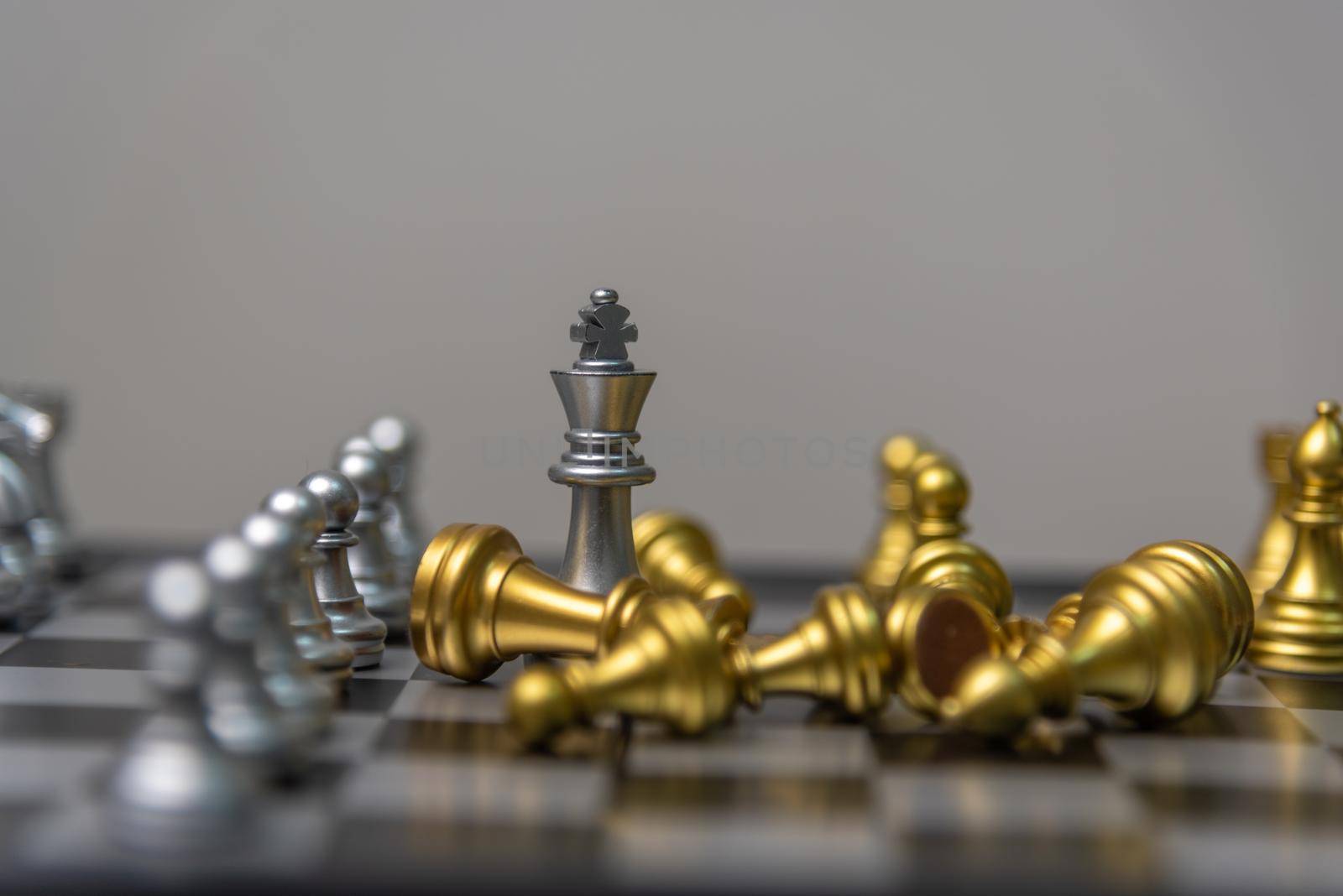 silver and gold chess on the board.Business investment finance marketing planning concept.