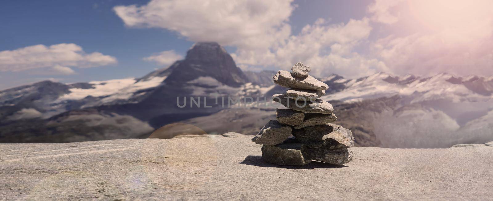 Stack of stones on top of the mountain. Pile of rocks stone and mountains. Balanced stone pyramid or Stacked stone or mountain stones tower. Stones arranged for meditation. Represent spirit of Zen.