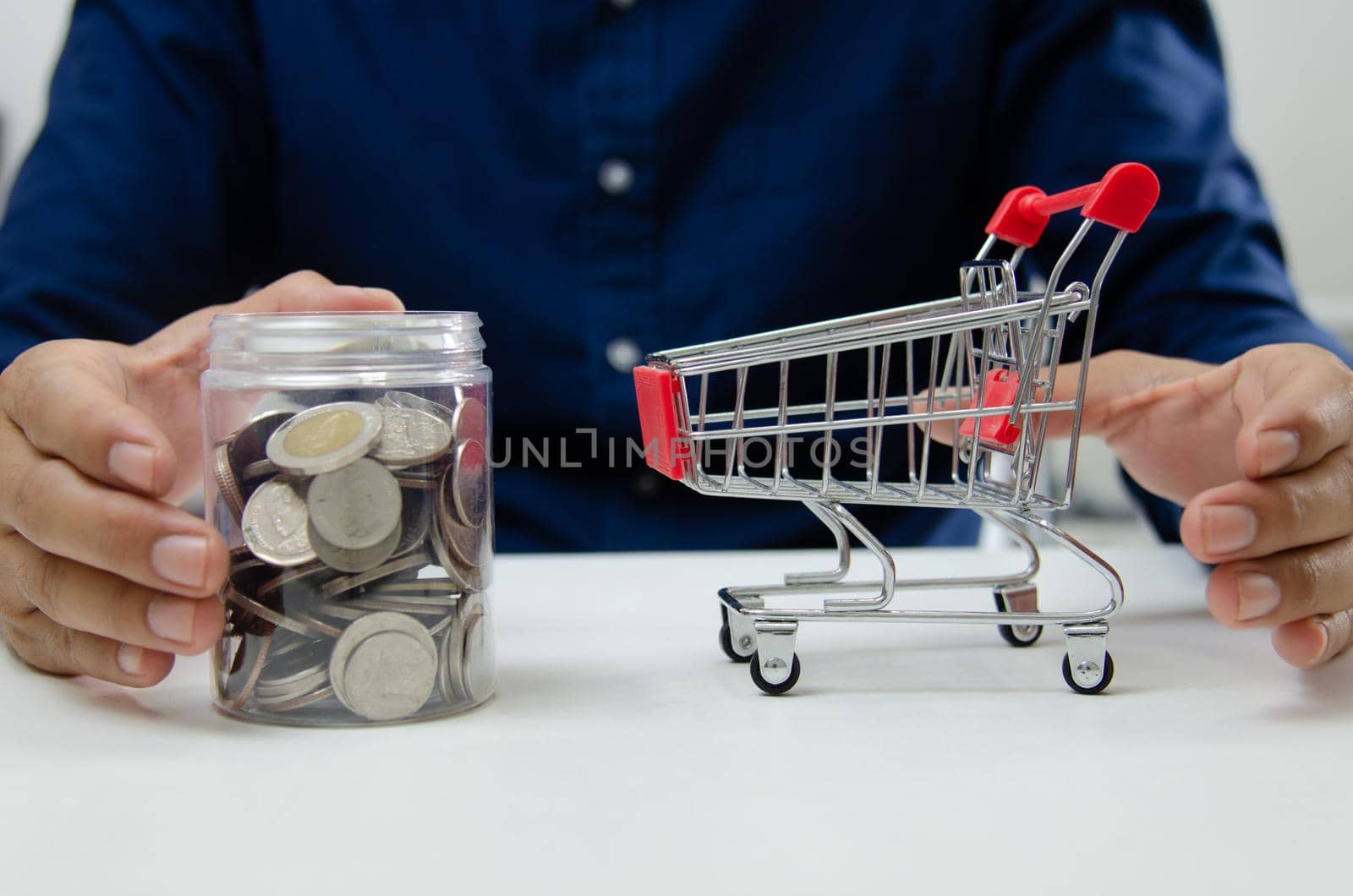 Business finance and investment economy shopping concept. Businessman money coin saving and jar.
