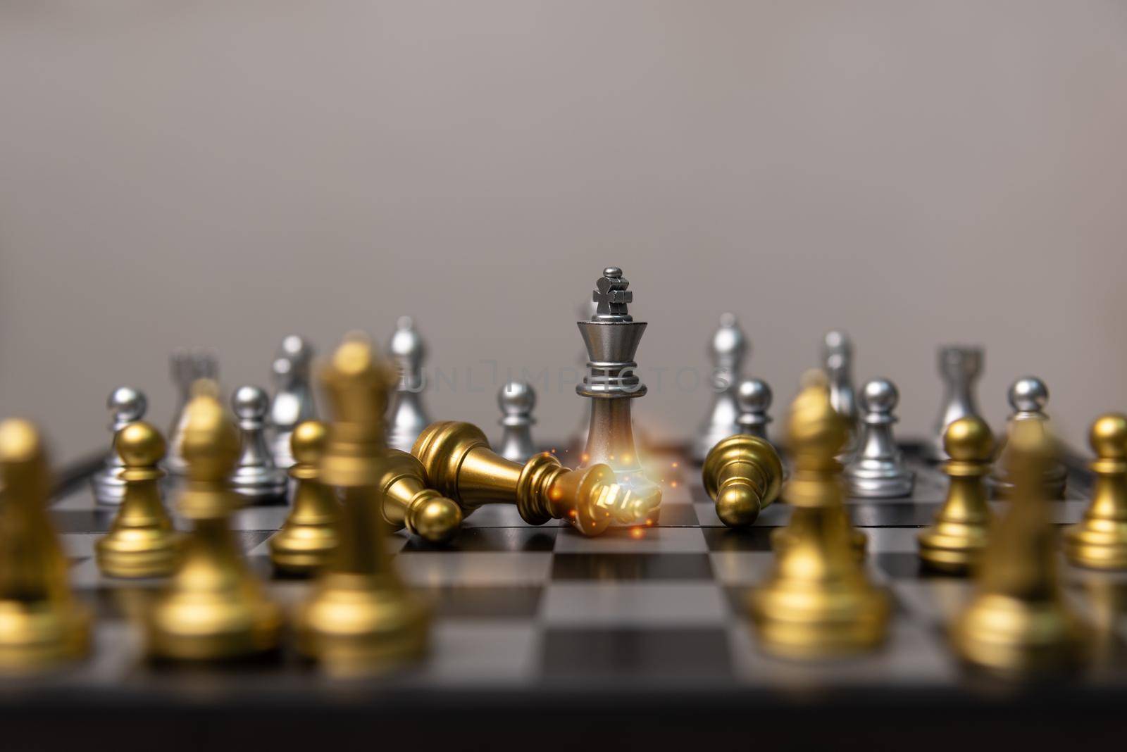 silver and gold chess on the board.Business investment finance marketing planning concept.