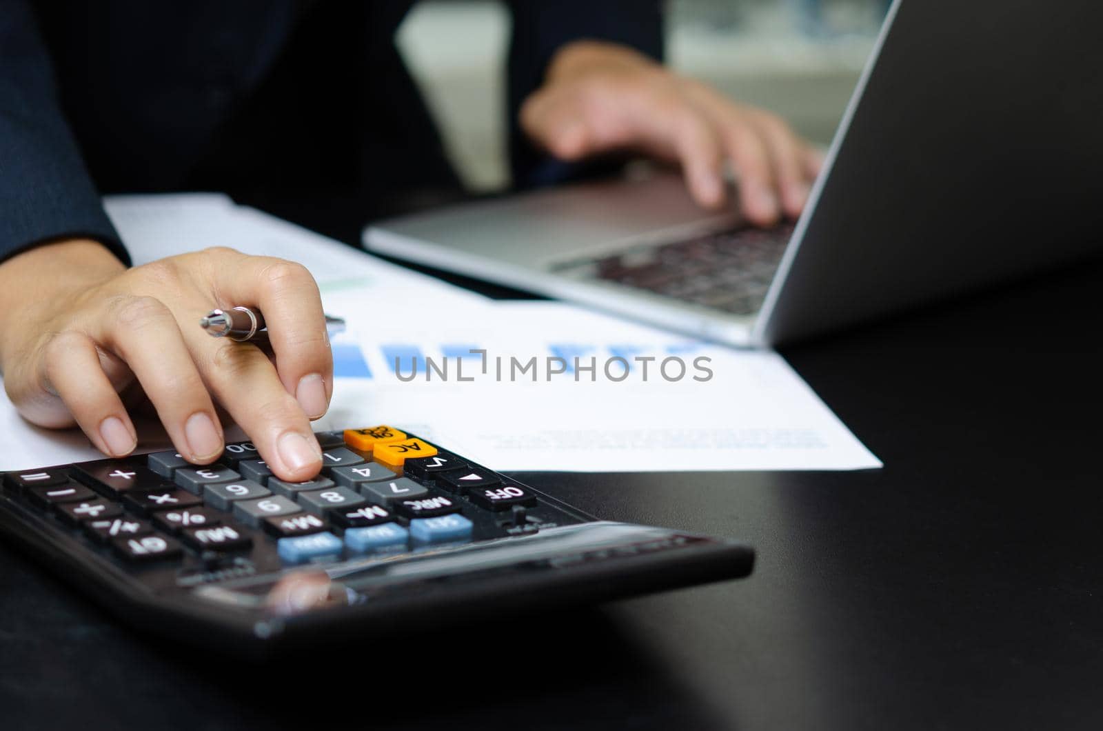 Business document finance report and accounting analysis graph.Businessman using calculate marketing investment chart paperwork statistic on desk. by aoo3771