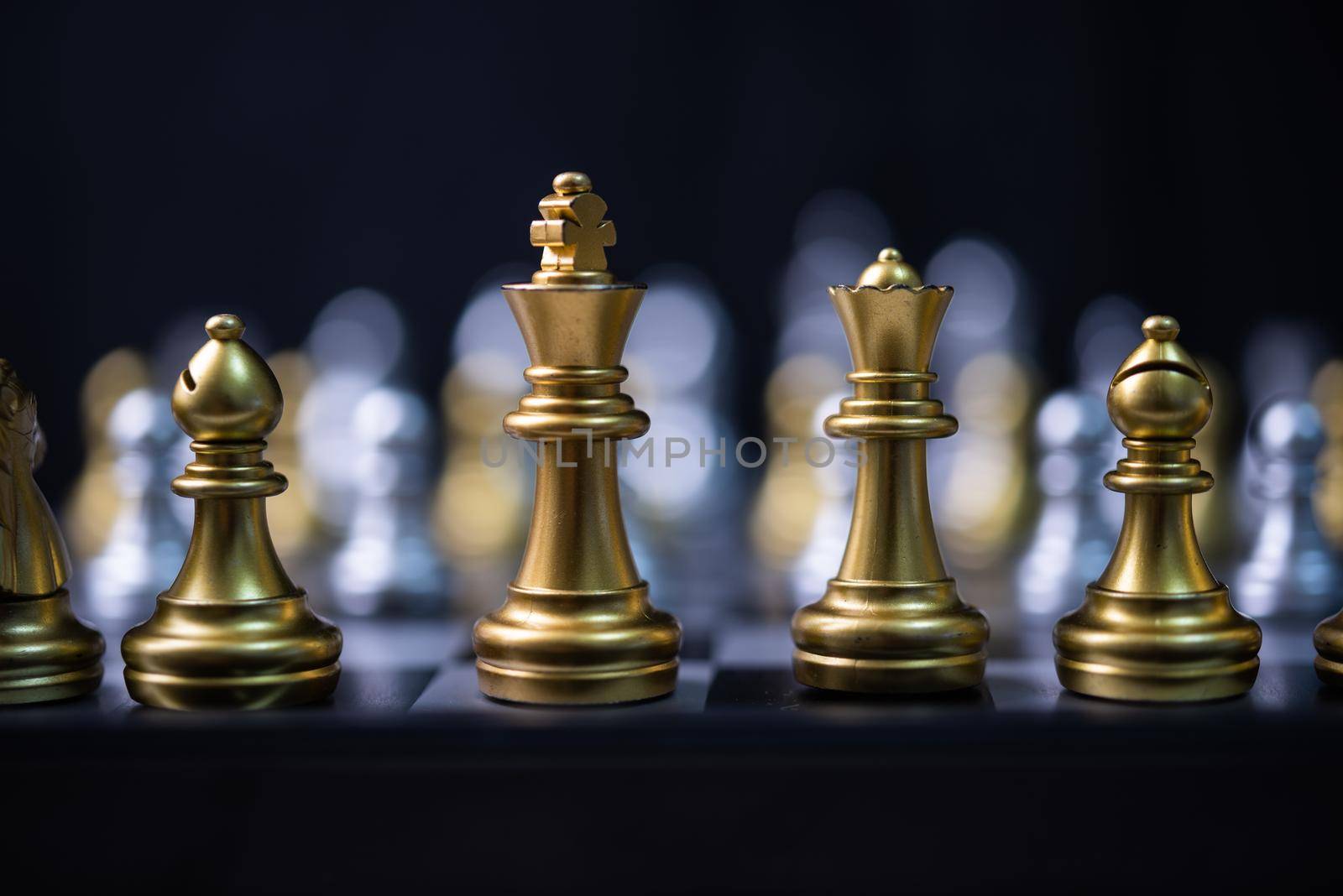 silver and gold chess on the board.Business investment finance marketing planning concept.