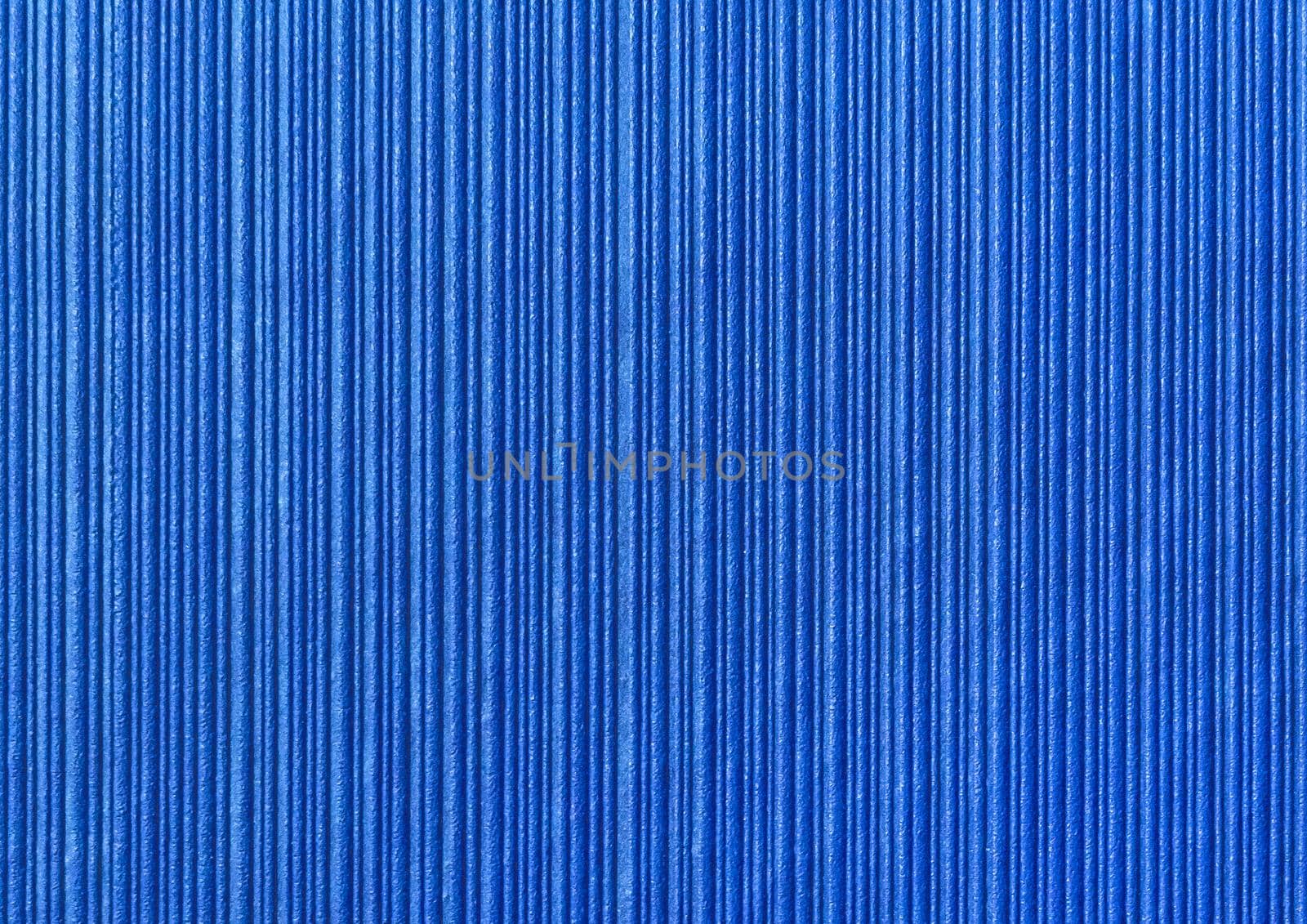 Blue abstract striped pattern wallpaper background, paper texture with vertical lines.