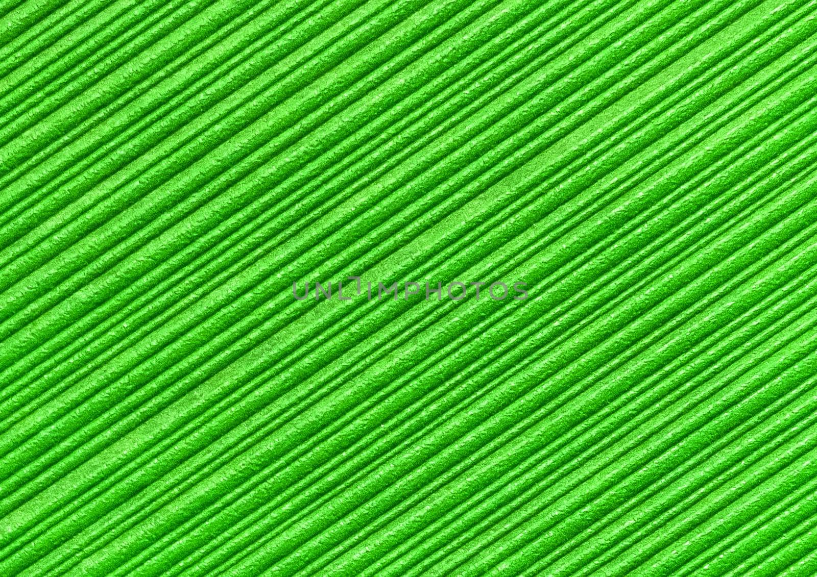 Green abstract striped pattern wallpaper background, paper texture with diagonal lines.