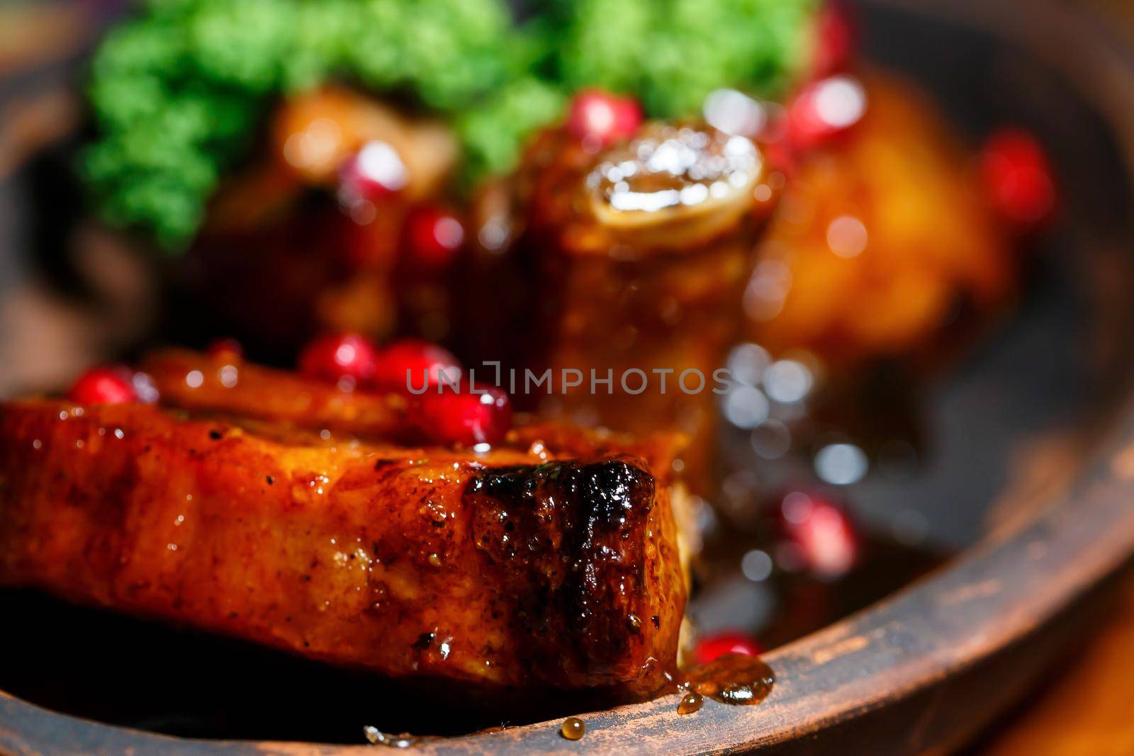 Baked ribs with pomegranate sauce. Original dish from the chef