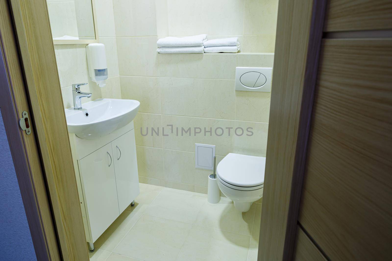 Bright bathroom, white toilet, washbasin, mirror, shower