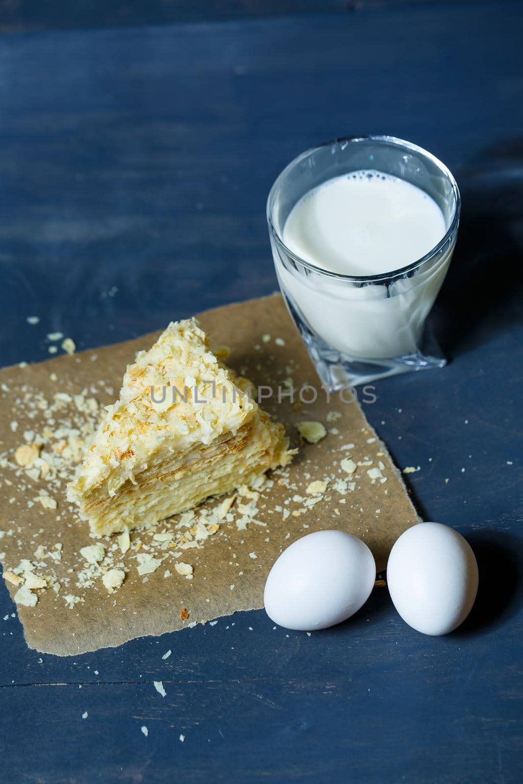 homemade Napoleon cake with cream on a gray background