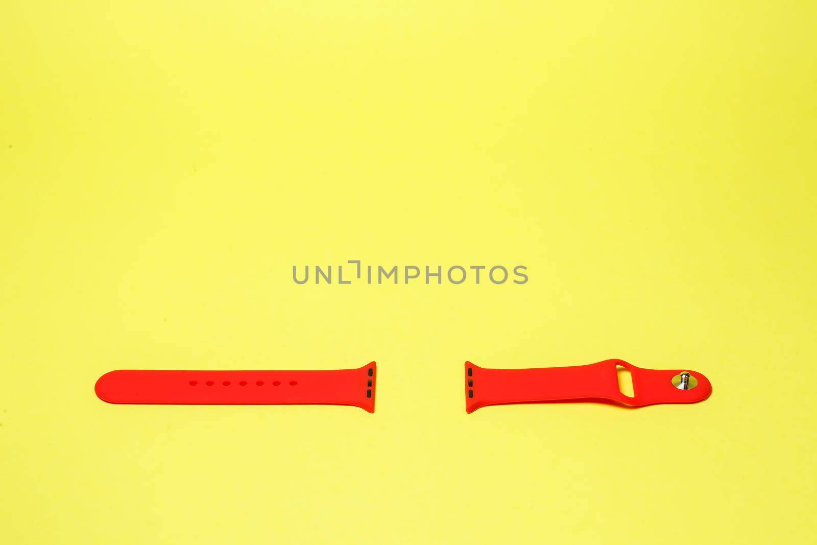 silikone strap for smart watch red color on yelow background