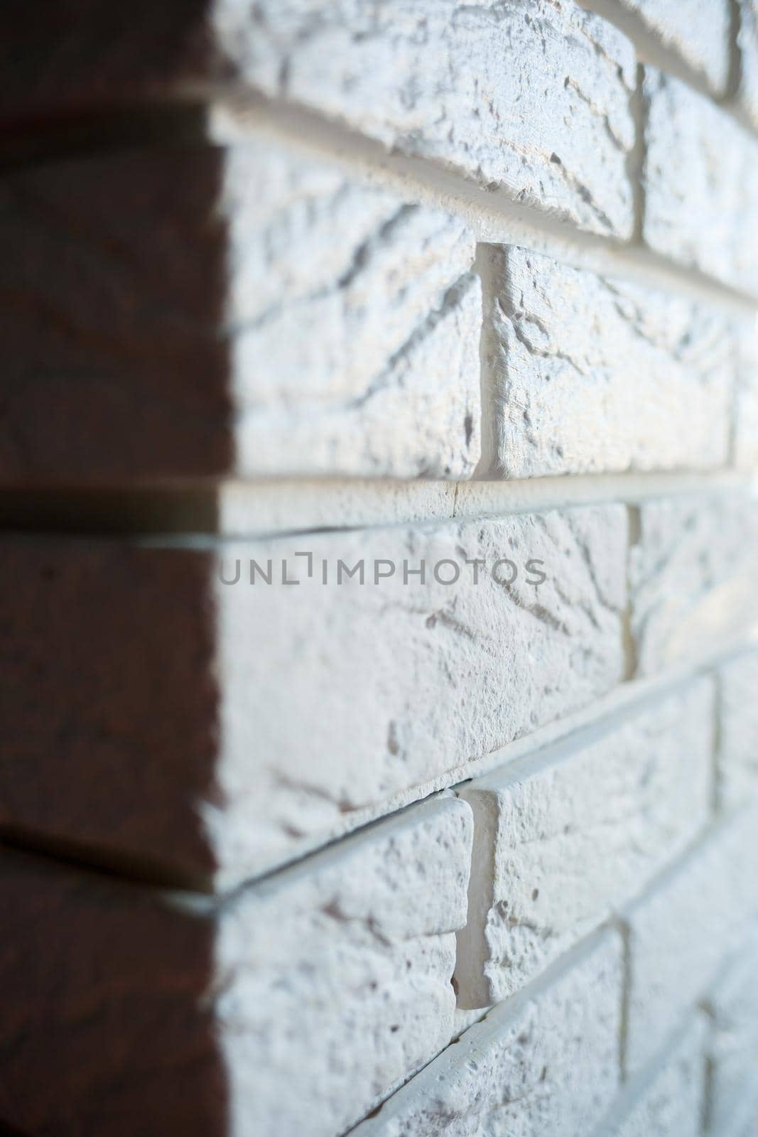 painting plaster decorative brick with white paint