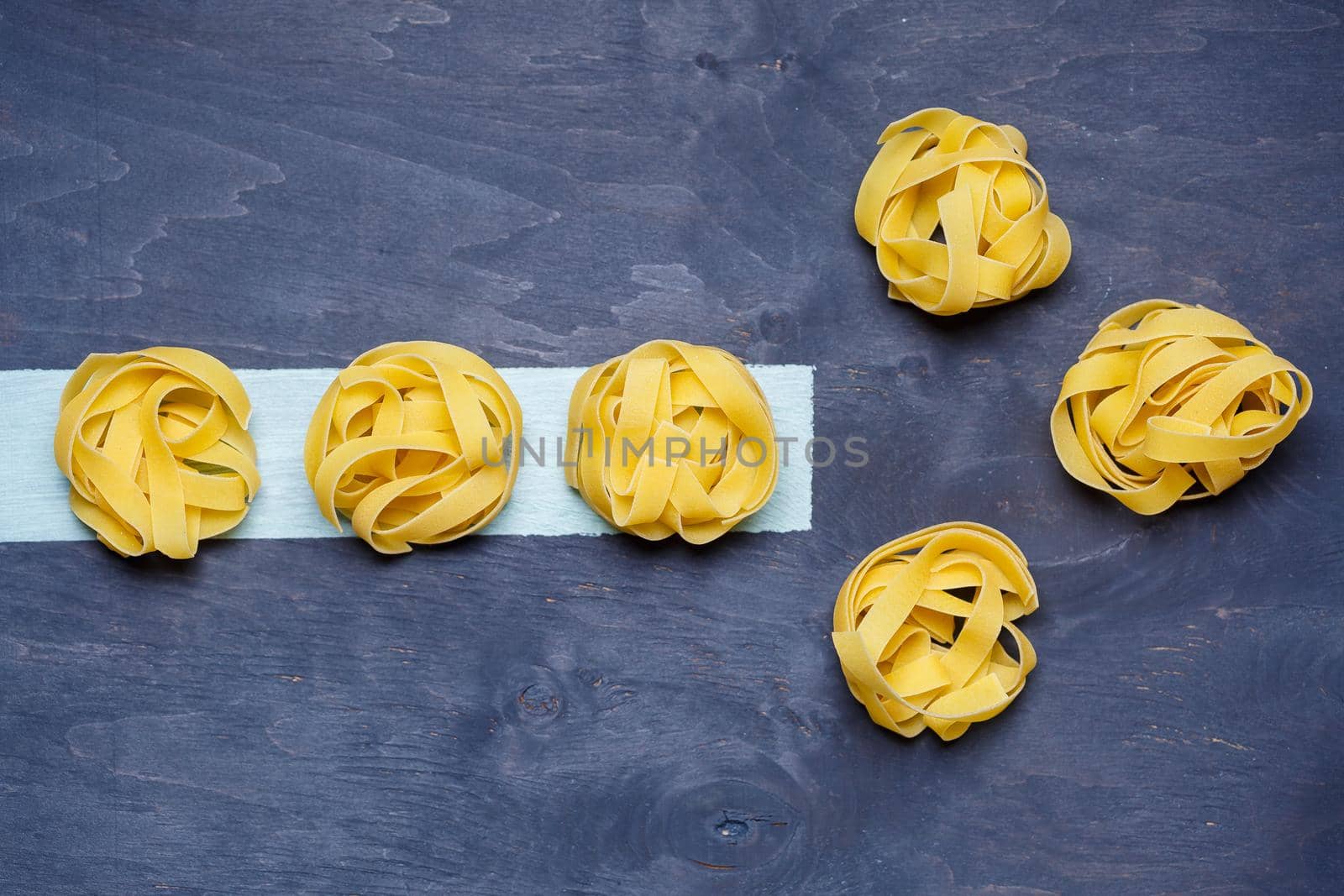 Pasta with durum wheat. Food for vegans. Proper nutrition, healthy food. Gray background