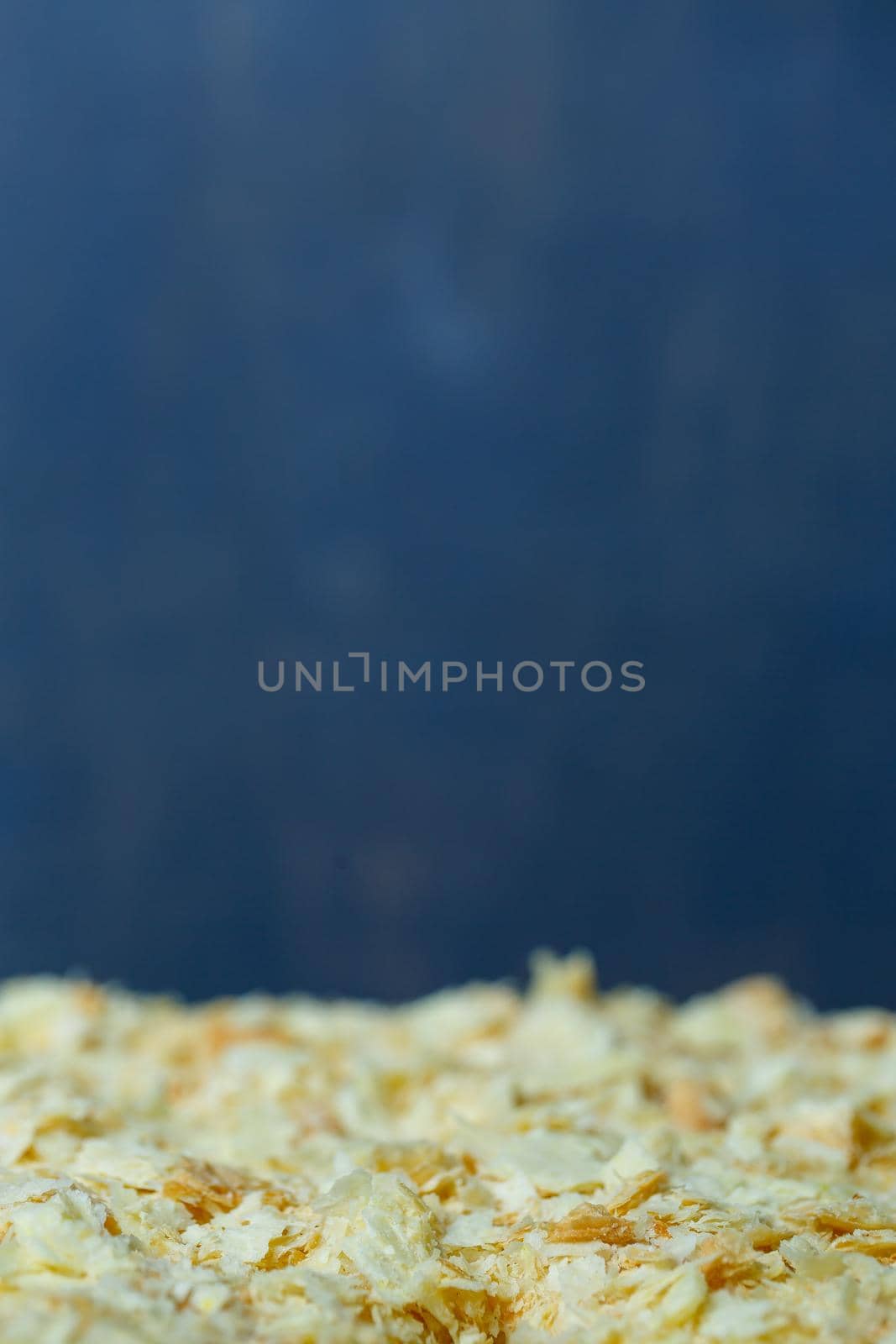homemade Napoleon cake with cream on a gray background