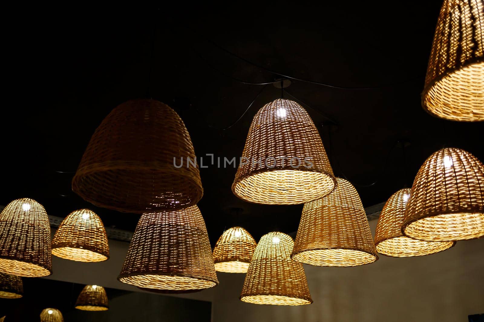 large wooden chandeliers with bulbs in the interior