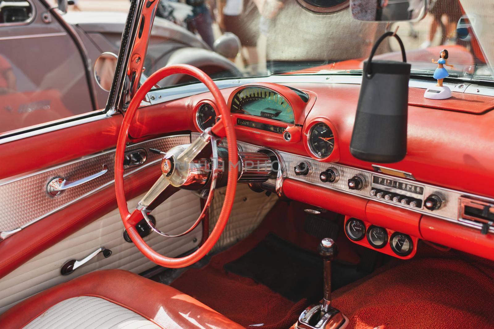 PARIS, FRANCE - MAY, 15, 2022: Leather interior of red Ford Thunderbird 1956