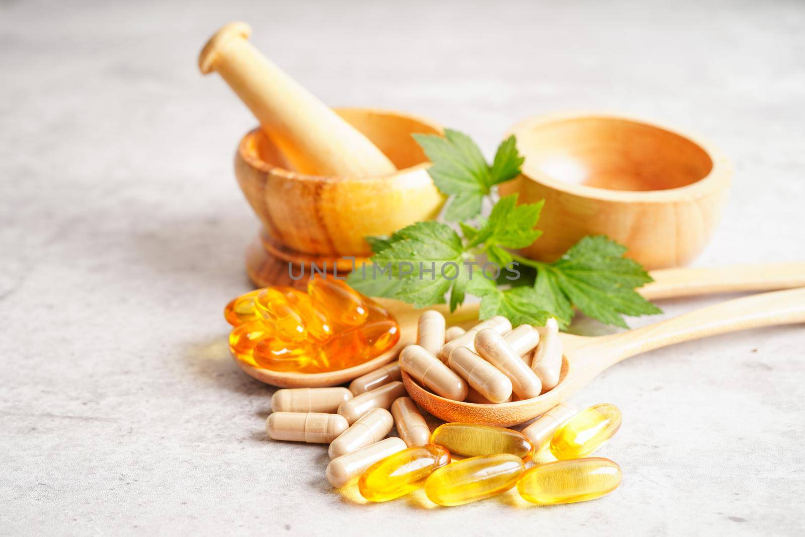 Alternative medicine herbal organic capsule with vitamin E omega 3 fish oil, mineral, drug with herbs leaf natural supplements for healthy good life.
