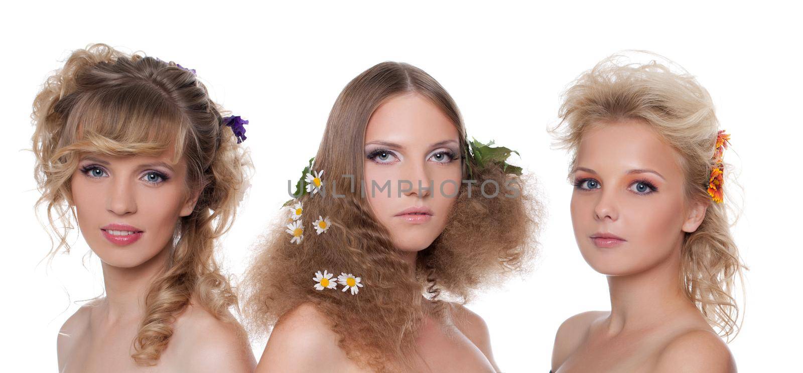 Three beautiful naked young women with season flower hair style