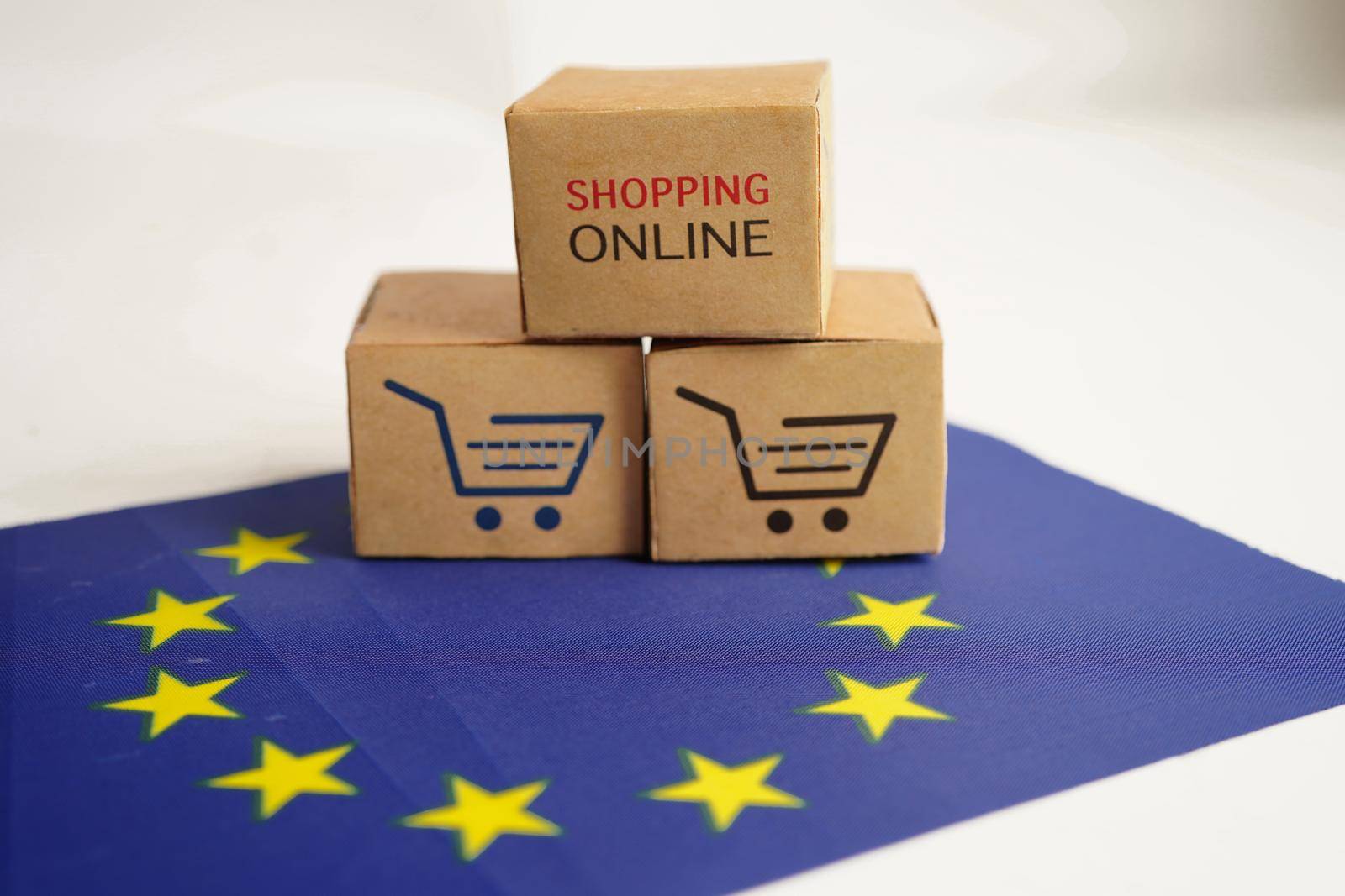Online shopping, Shopping cart box on EU flag, import export, finance commerce.