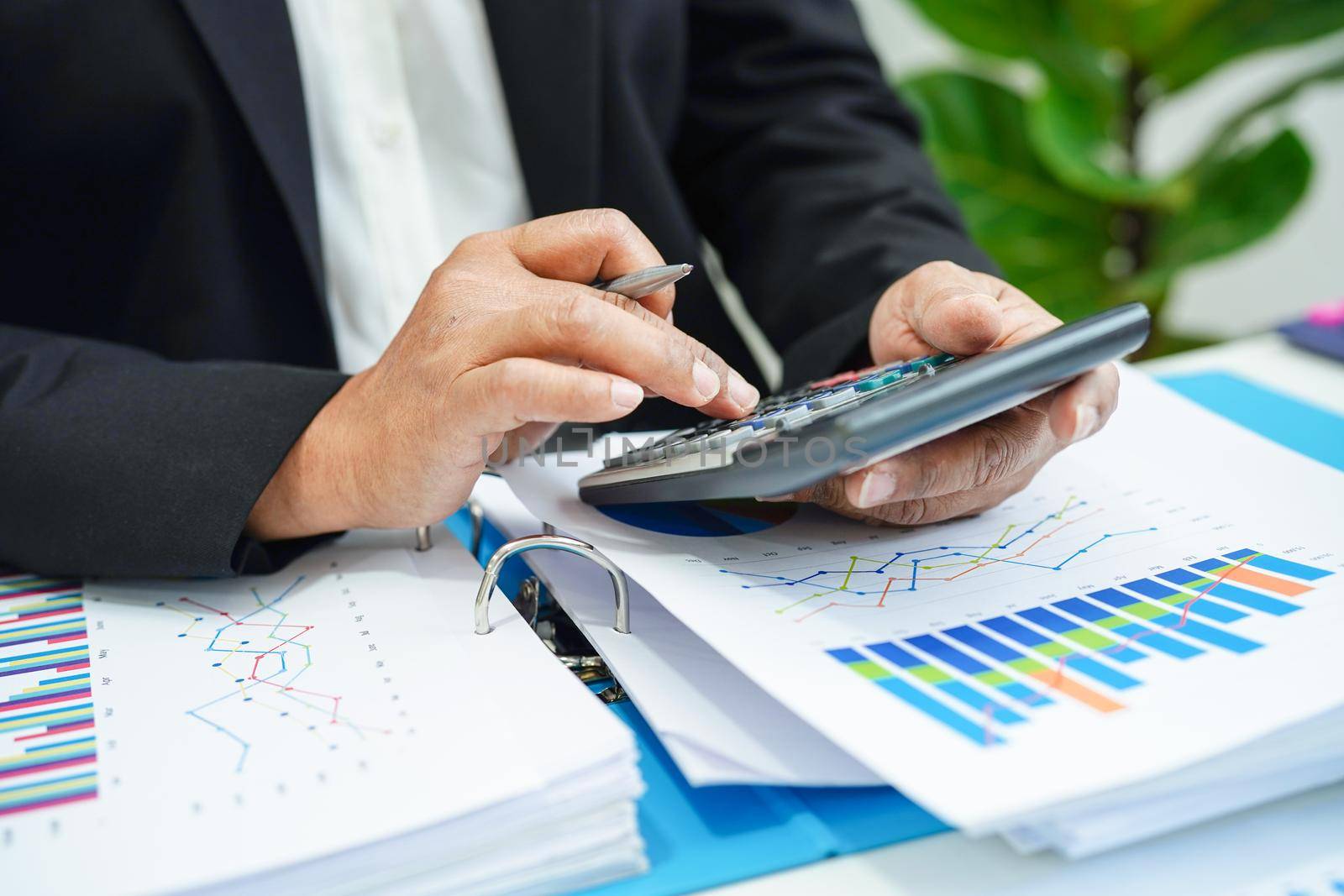 Business woman working and analysis with statistic graph in office. 